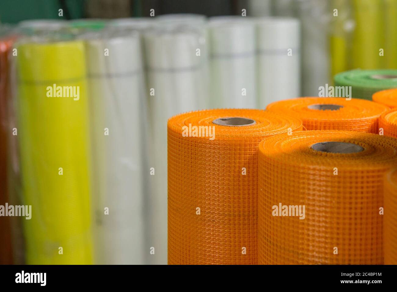 Rolls of colored fiberglass mesh, building materials for wall insulation,  close-up Stock Photo - Alamy