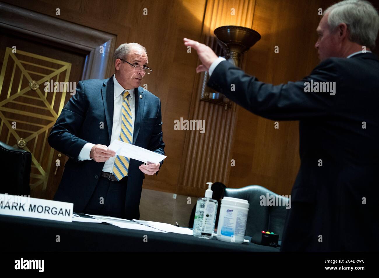 Mark A. Morgan, acting commissioner of the U.S. Customs and Border Protection, talks with United States Senator Ron Johnson (Republican of Wisconsin), Chairman, US Senate Committee on Homeland Security and Government Affairs, before the hearing titled "CBP Oversight: Examining the Evolving Challenges Facing the Agency," in Dirksen Senate Office Building on Thursday, June 25, 2020. Credit: Tom Williams/Pool via CNP /MediaPunch Stock Photo