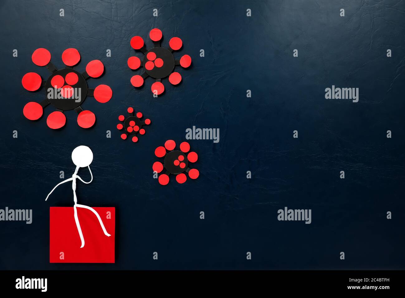 Anxiety, depression and mental health issue during covid-19 disease pandemic crisis concept. Human stick figure sitting and worrying with coronavirus. Stock Photo
