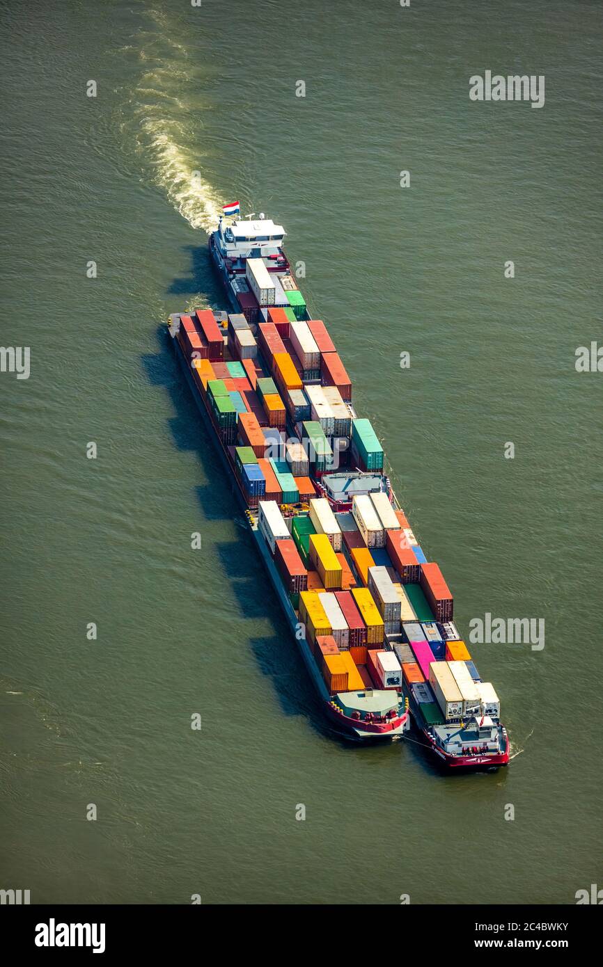 container ship on Rhine river, 07.04.2019, aerial view, Germany, North Rhine-Westphalia, Ruhr Area, Voerde Stock Photo