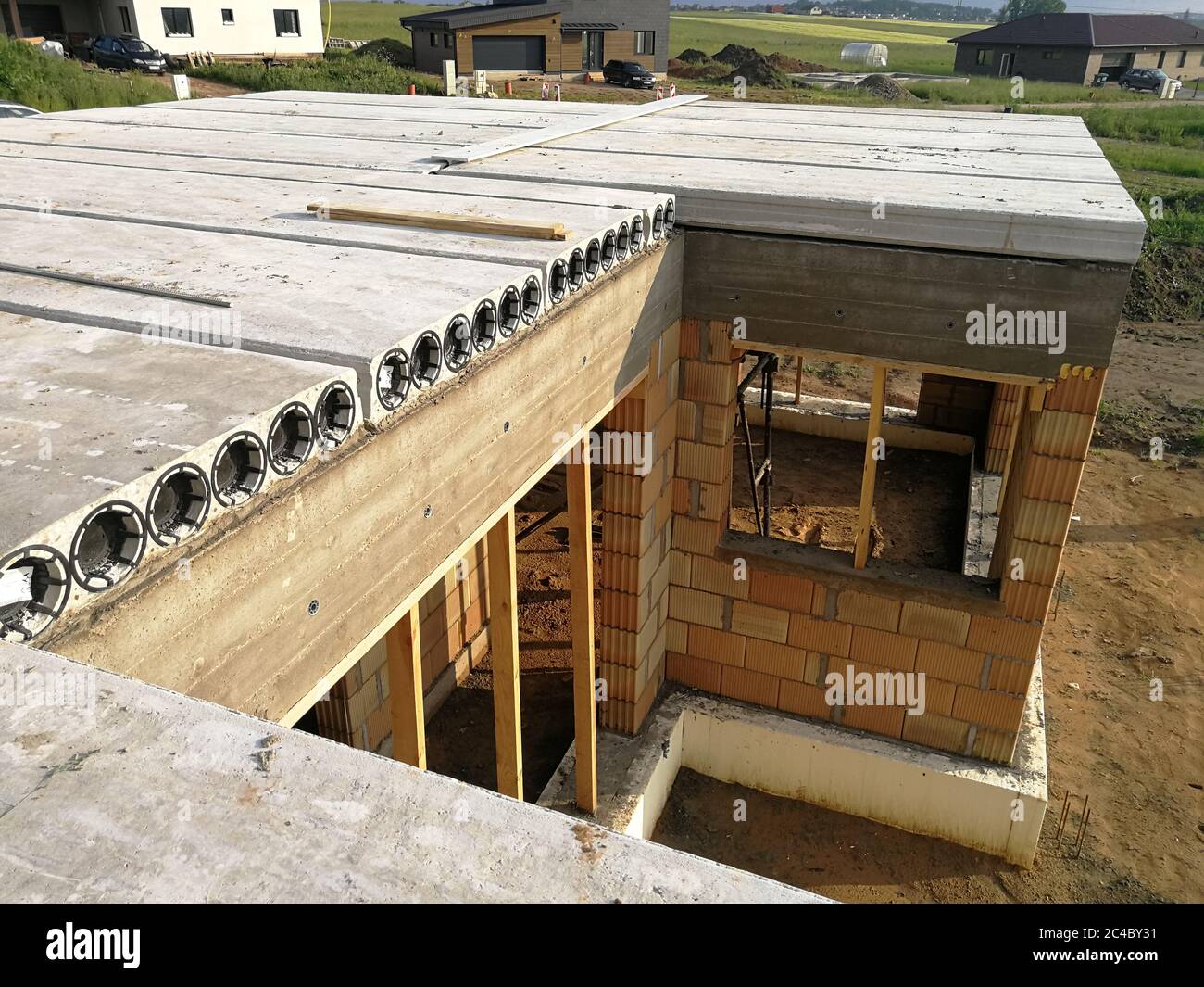 https://c8.alamy.com/comp/2C4BY31/concrete-hollow-core-slabs-close-up-at-constructions-site-construction-industry-concept-2C4BY31.jpg