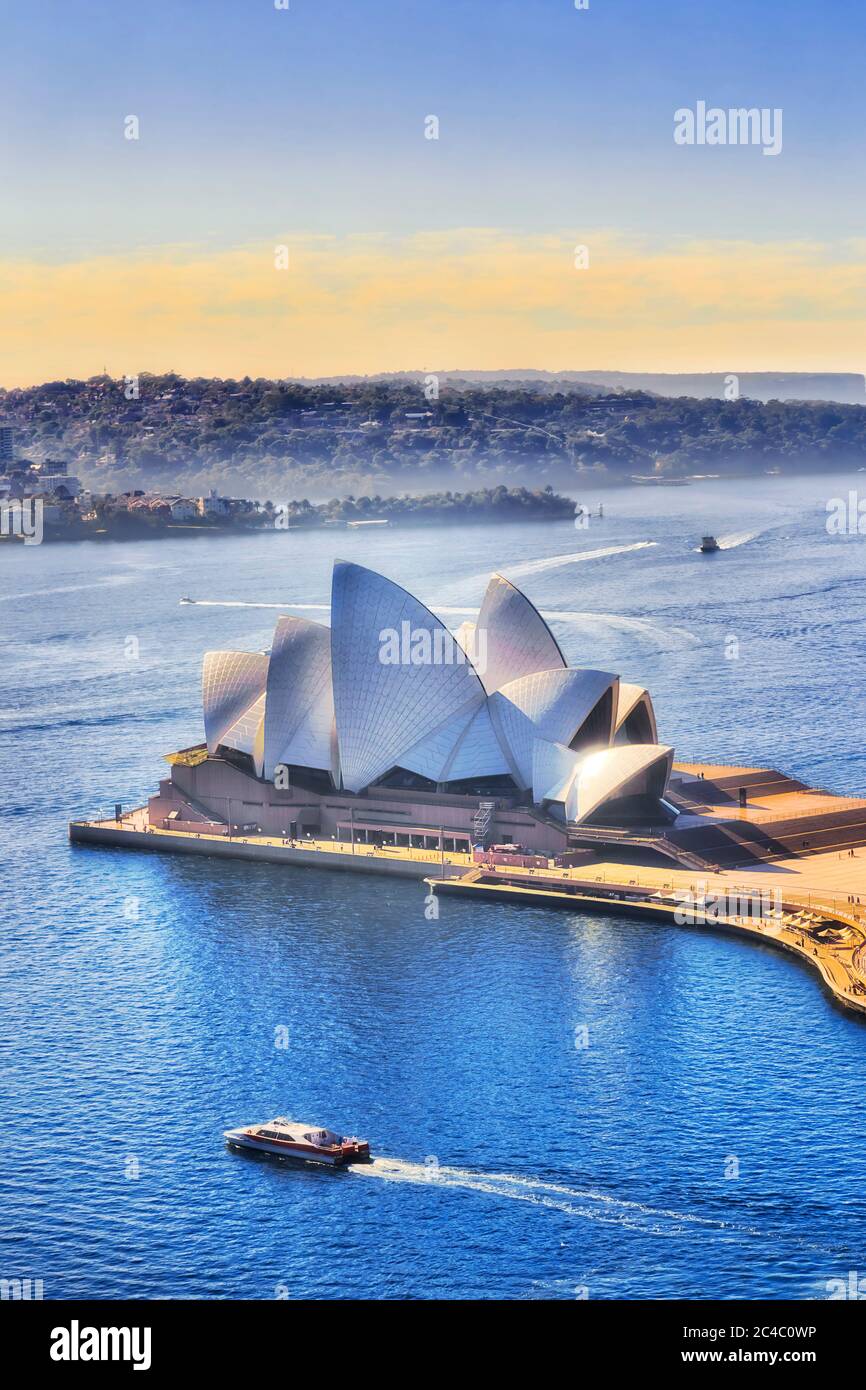 Sydney, Autralia - 20 June 2020: Sydney Opera house on Sydney harbour in soft morning light. Stock Photo