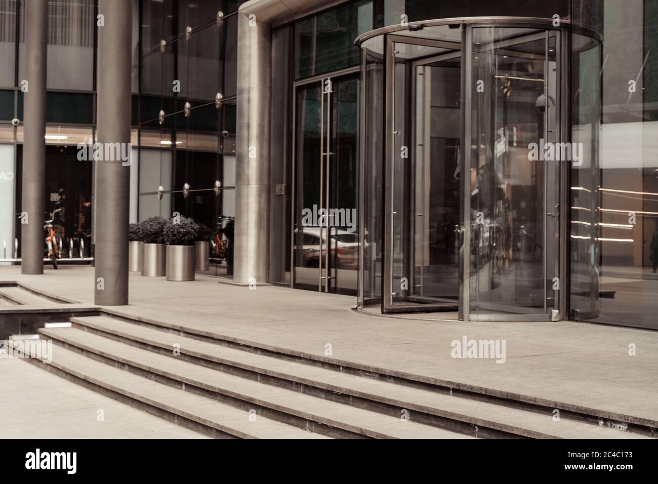 Curved doorway to the office, bank, corporation. Glass and metal doors. Stock Photo