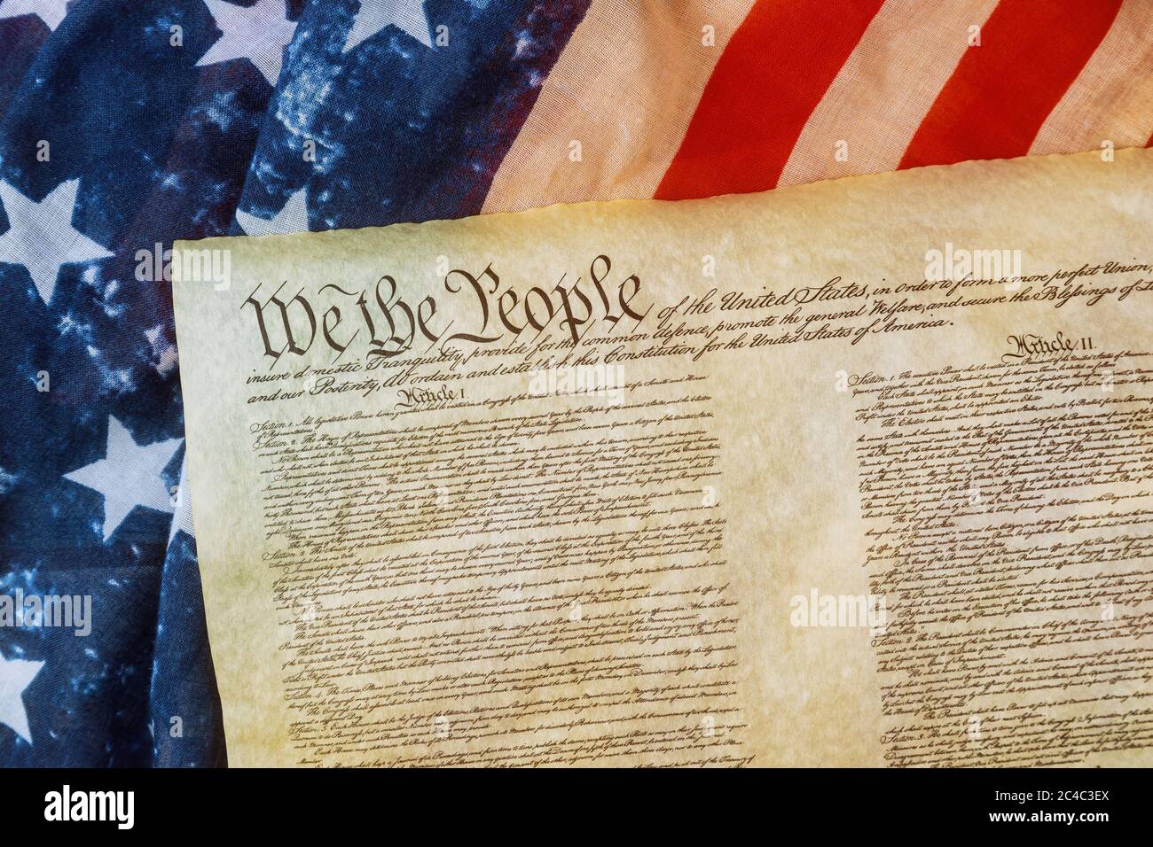 Closeup of a replica of U.S. Constitution document of grunge American flag on We the people Bill of Rights Stock Photo