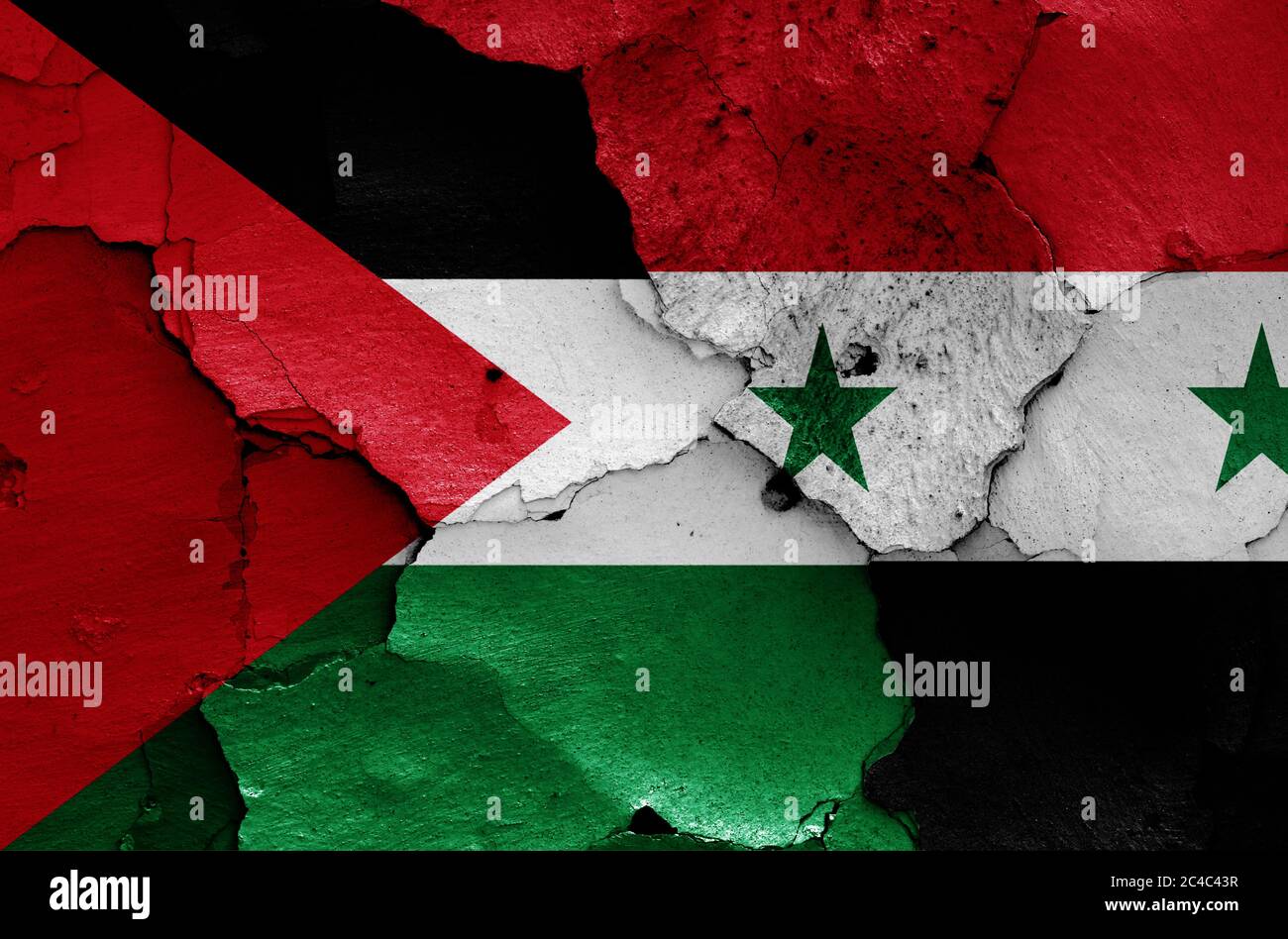 flags of Palestine and Syria painted on cracked wall Stock Photo