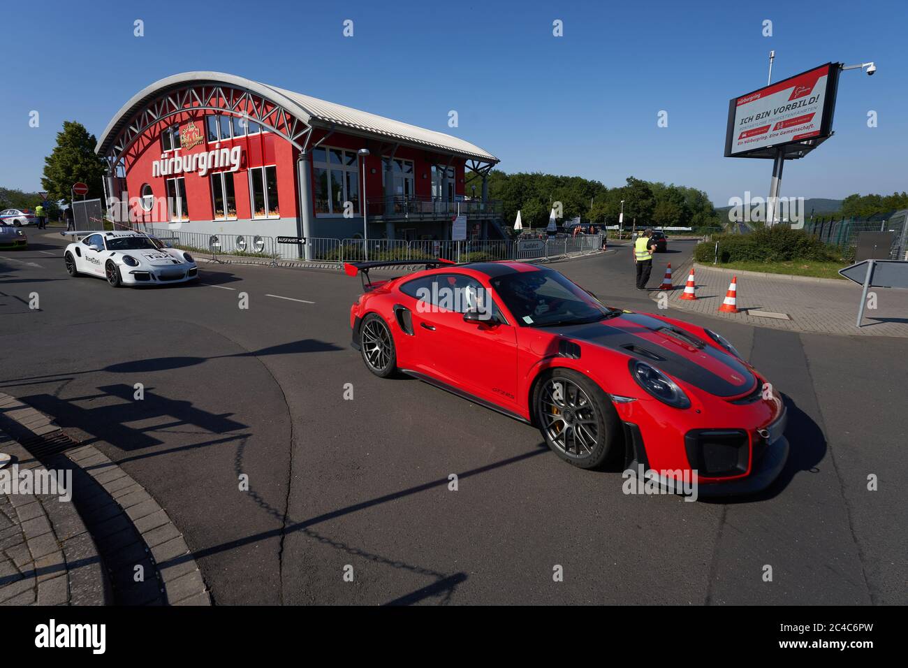 23 June 2020, Rhineland-Palatinate, Nürburg: Hobby racing drivers start off  on tourist trips on the legendary Nordschleife of the Nürburgring. During  the contactless tourist drives, hobby racing drivers can load a credit
