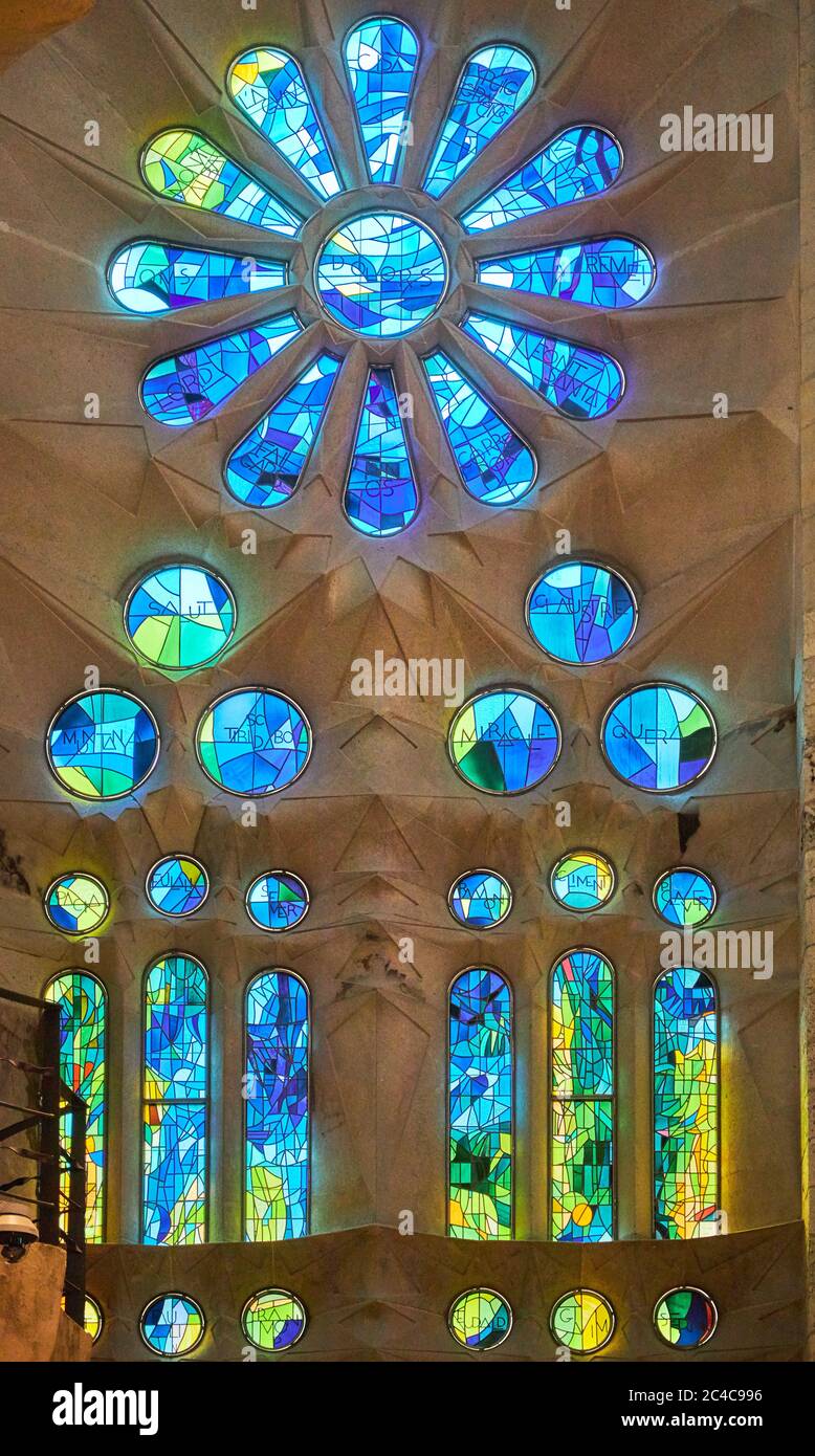 On one side Sagrada Familia's stained glass windows reflect cool