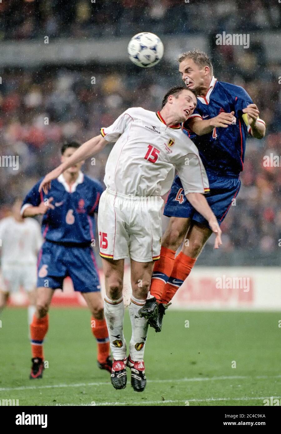 Frank DE BOER (4) of Holland heads away from Philippe CLEMENT (15) of Belgium during a match at the FIFA World Cup of 1998. Stock Photo