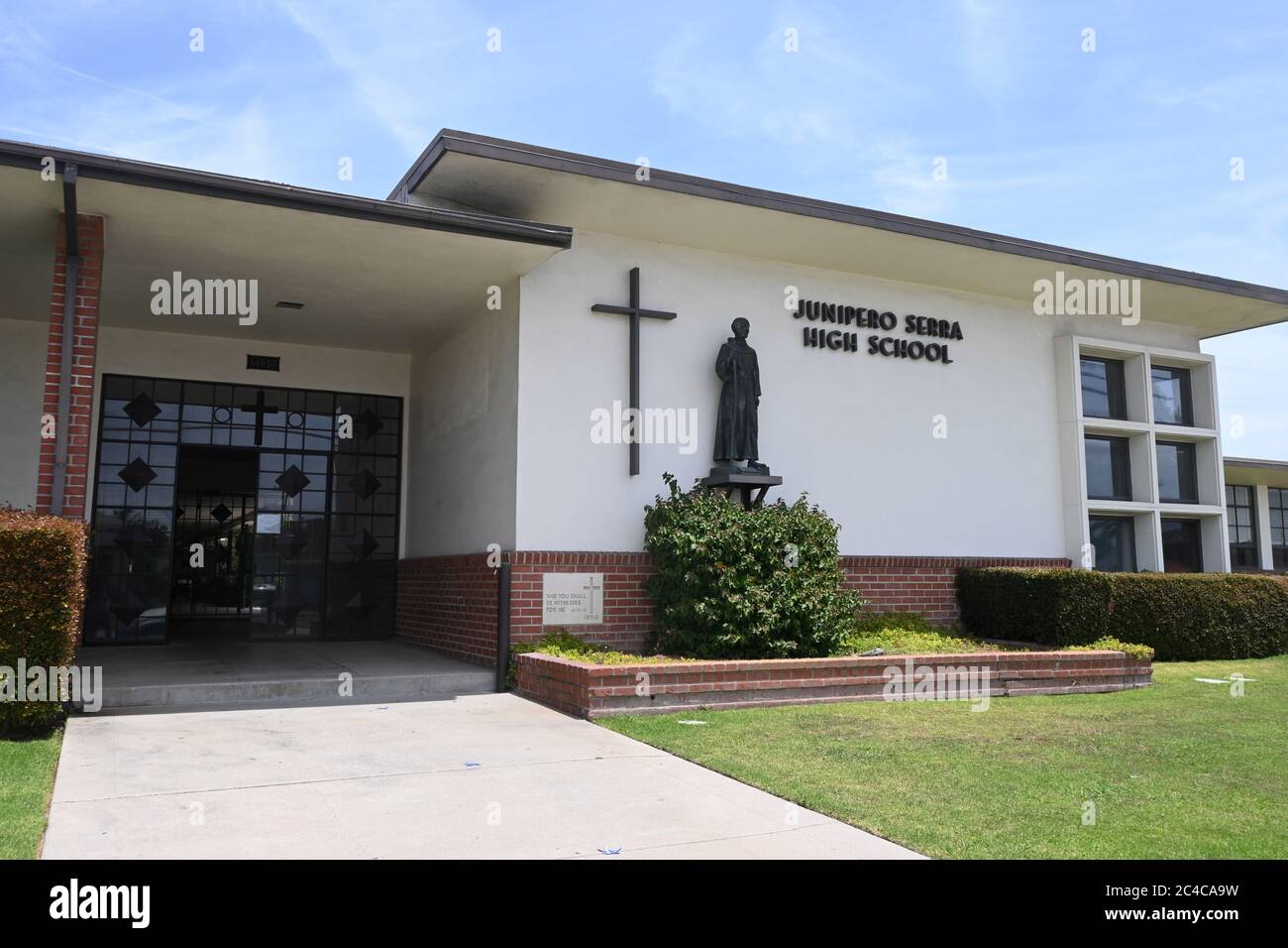 Gardena, United States. 24th June, 2020. A statue and cross at Junipero