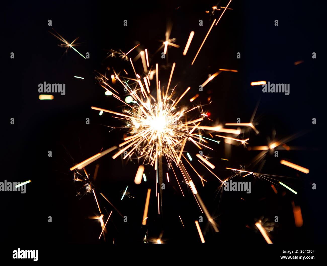 Lighting a Colorful Firework Sparkler In Celebration of the Holidays