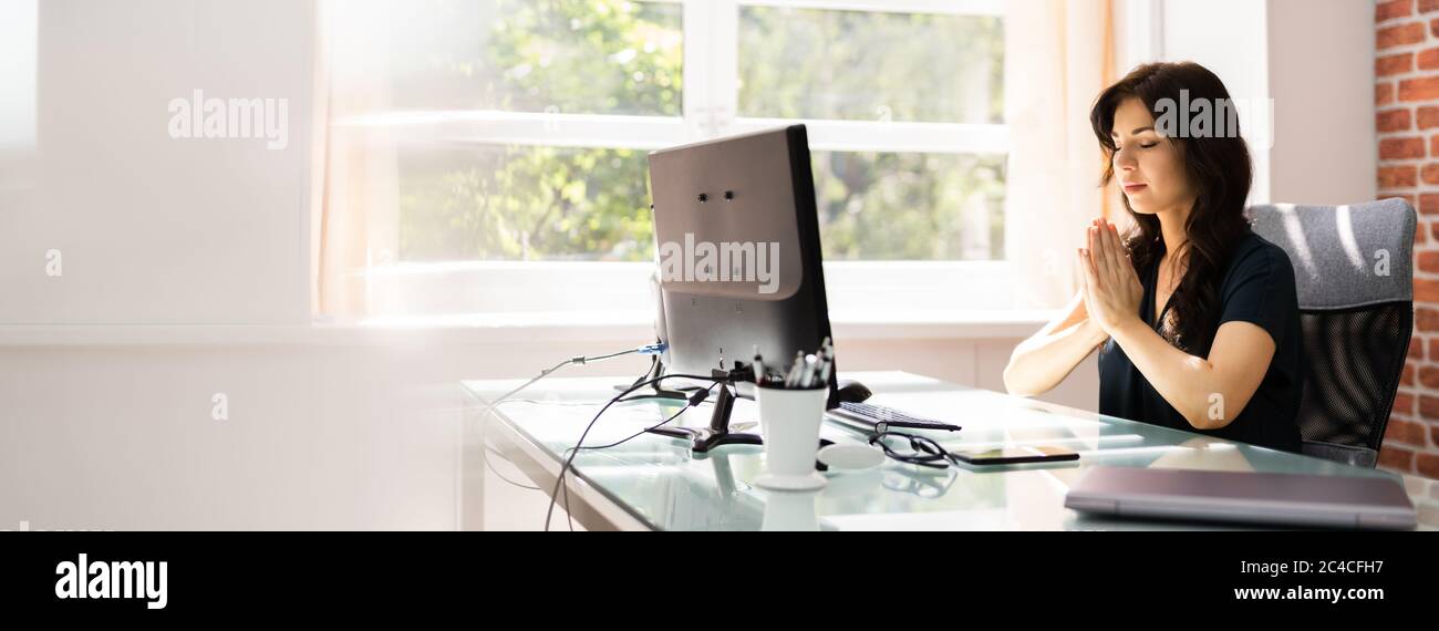Pray Computer Employee Woman Praying Near Computer At Office Stock Photo - Alamy