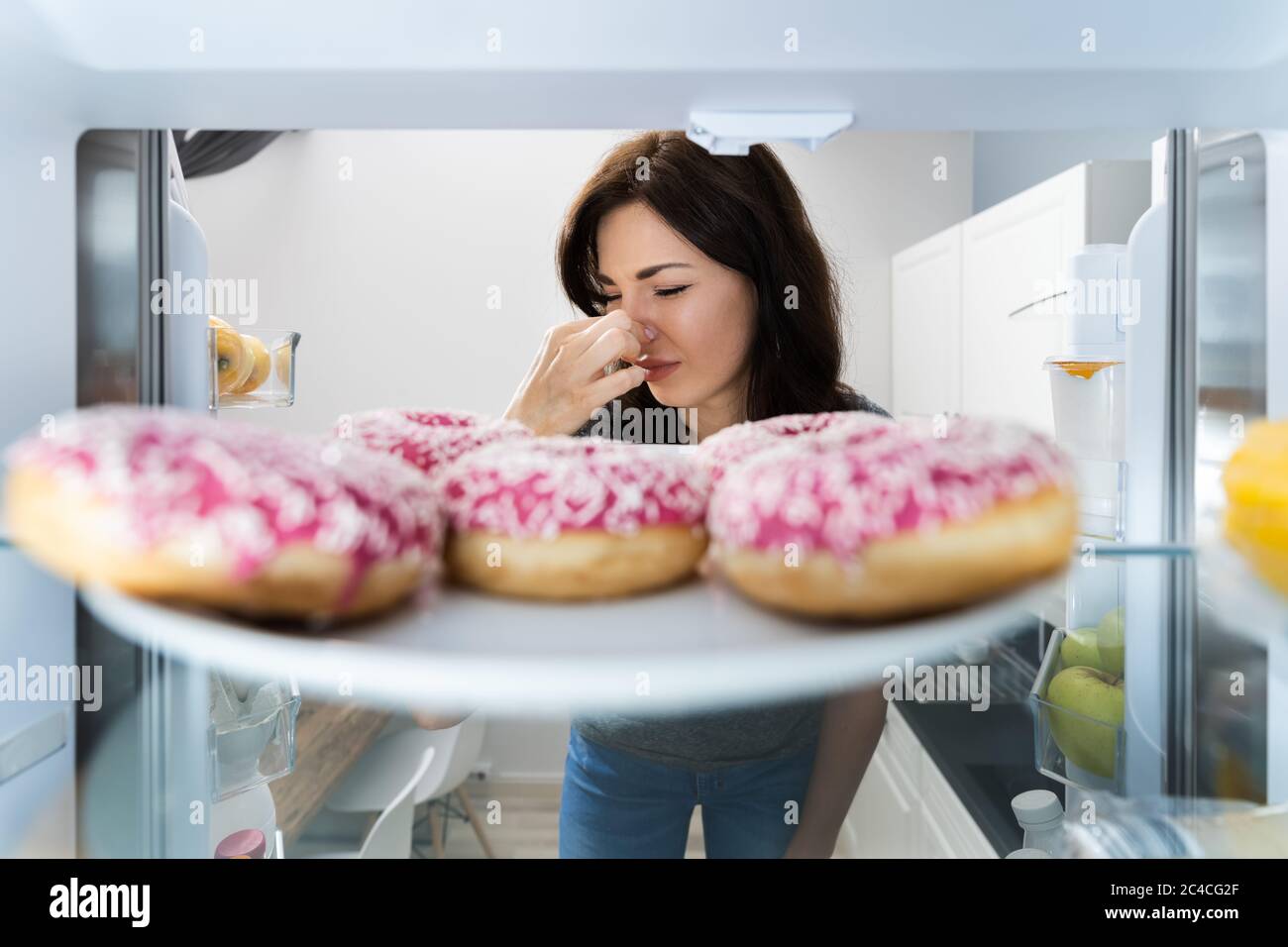 Bad Smell In Fridge. Rotten Food In Refrigerator Stock Photo