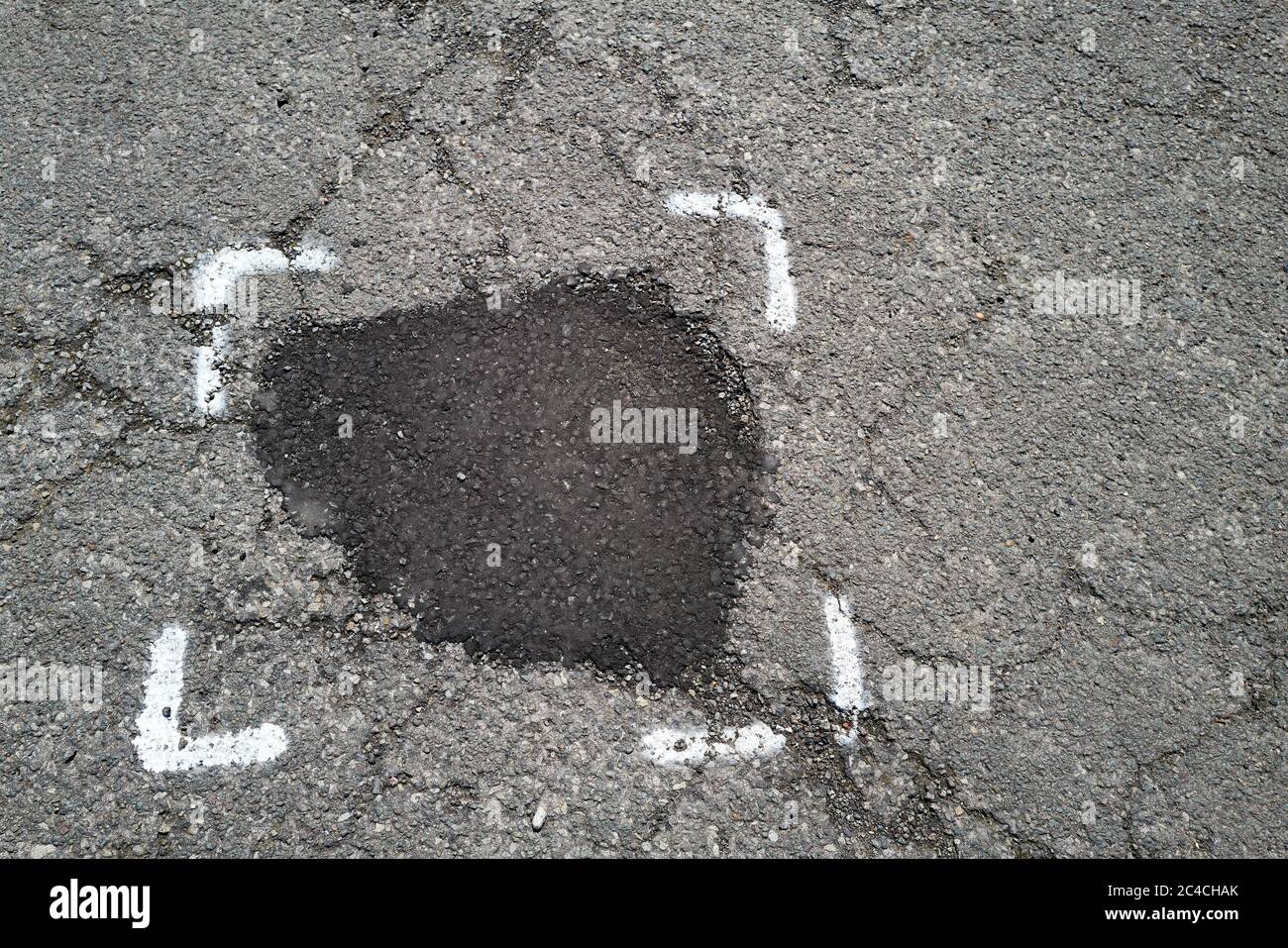 Patched Rpad Patched repair on a tarmac road Stock Photo - Alamy