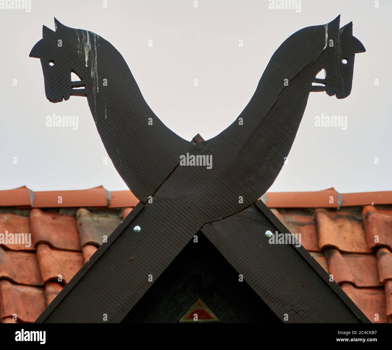 Horse heads carved from wood on the gable of a traditional Lower Saxon