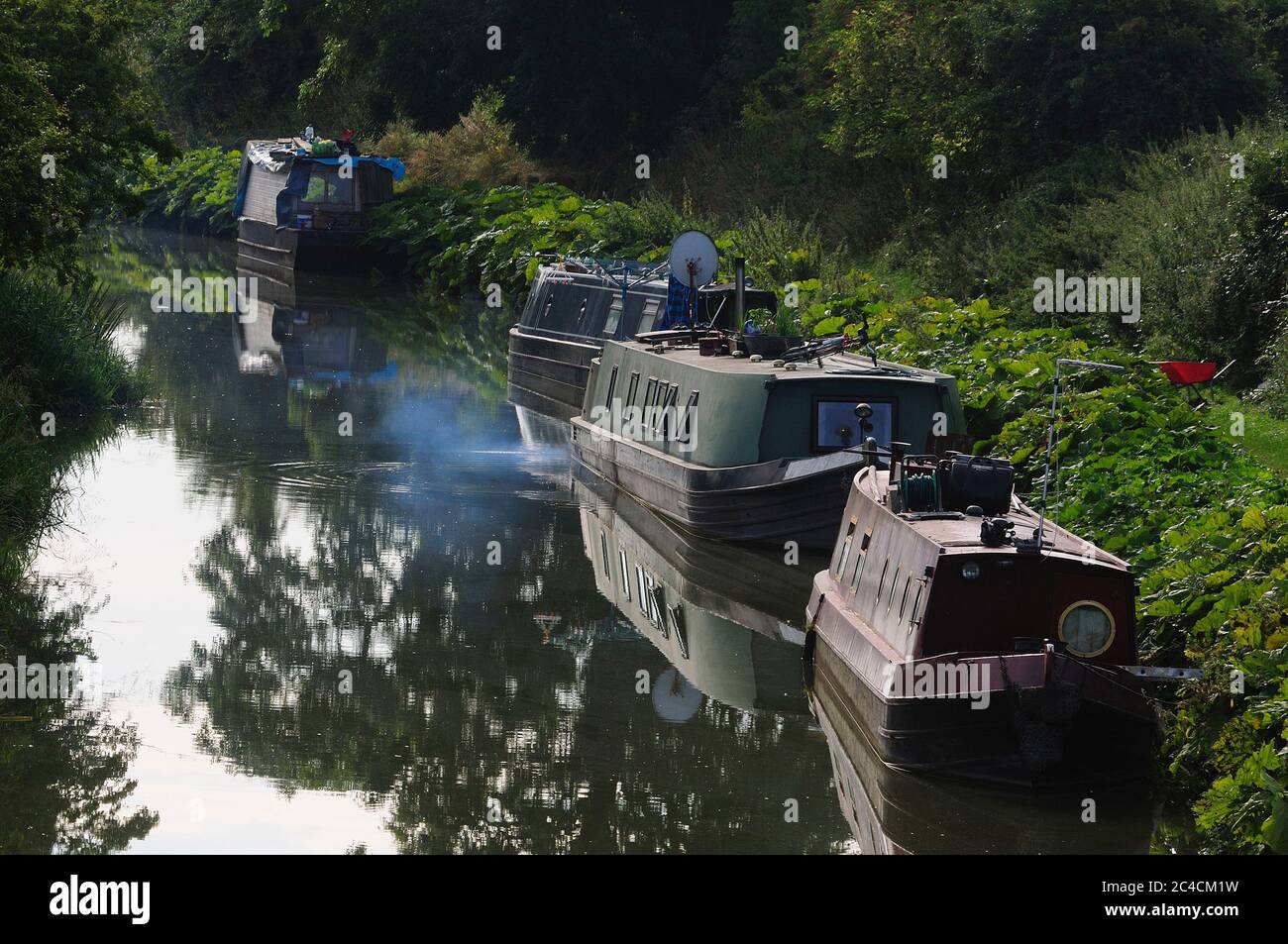 Canal boats moored near Stanton St.Bernard on the Kennet and Avon canal, Wiltshire Stock Photo