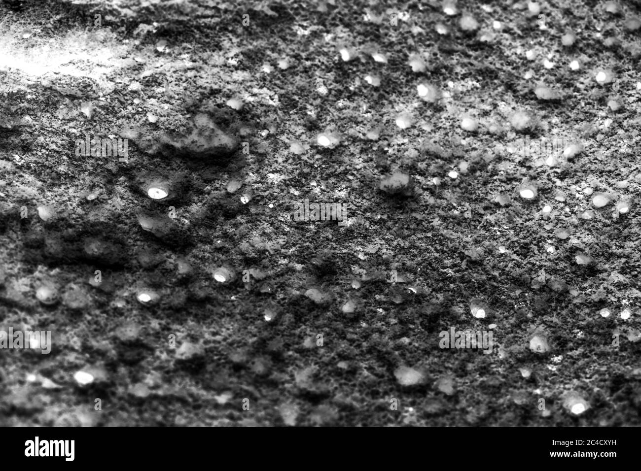 Black and white image of surface with little holes Stock Photo - Alamy