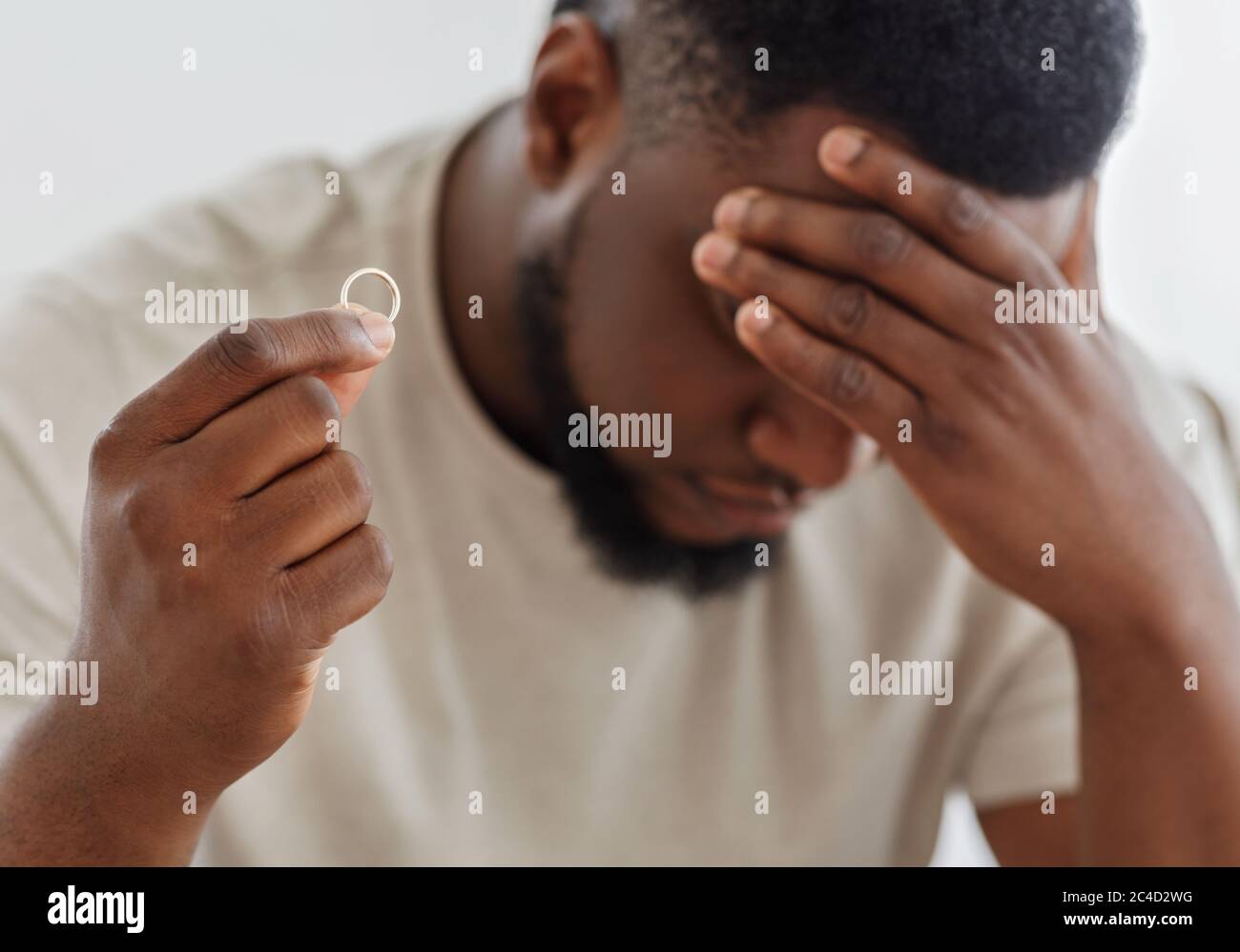 photo Black Guy Thinking Stock Image https www alamy com desperate black guy holding marriage ring thinking about divorce image364164012 html