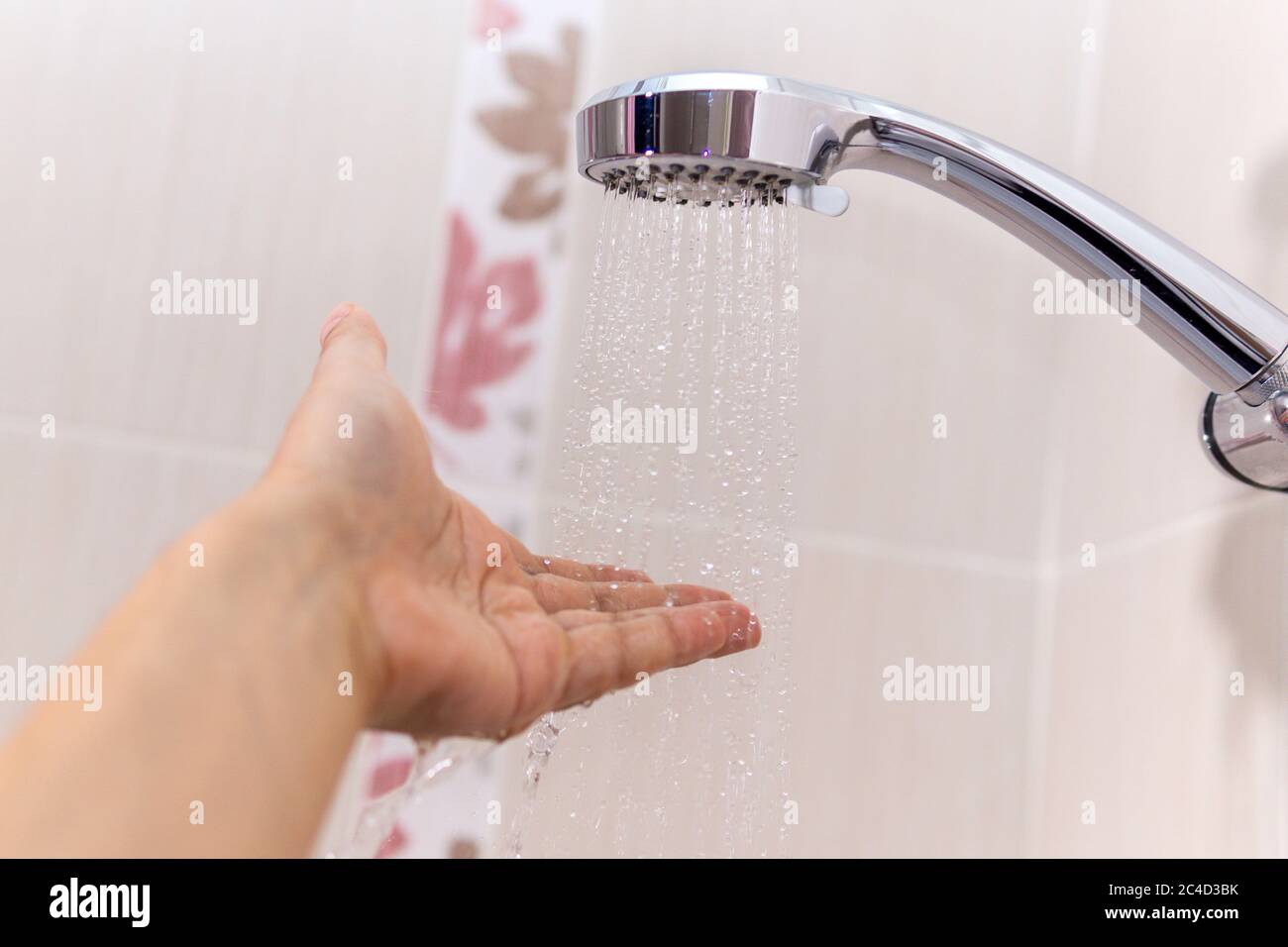 https://c8.alamy.com/comp/2C4D3BK/hands-check-the-temperature-of-the-shower-water-a-mans-hand-under-a-stream-of-water-selective-focus-2C4D3BK.jpg