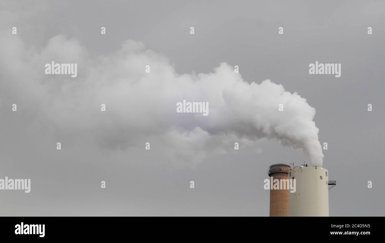 Industrial chimney with gases and smoke coming out - concept: air pollution Stock Photo