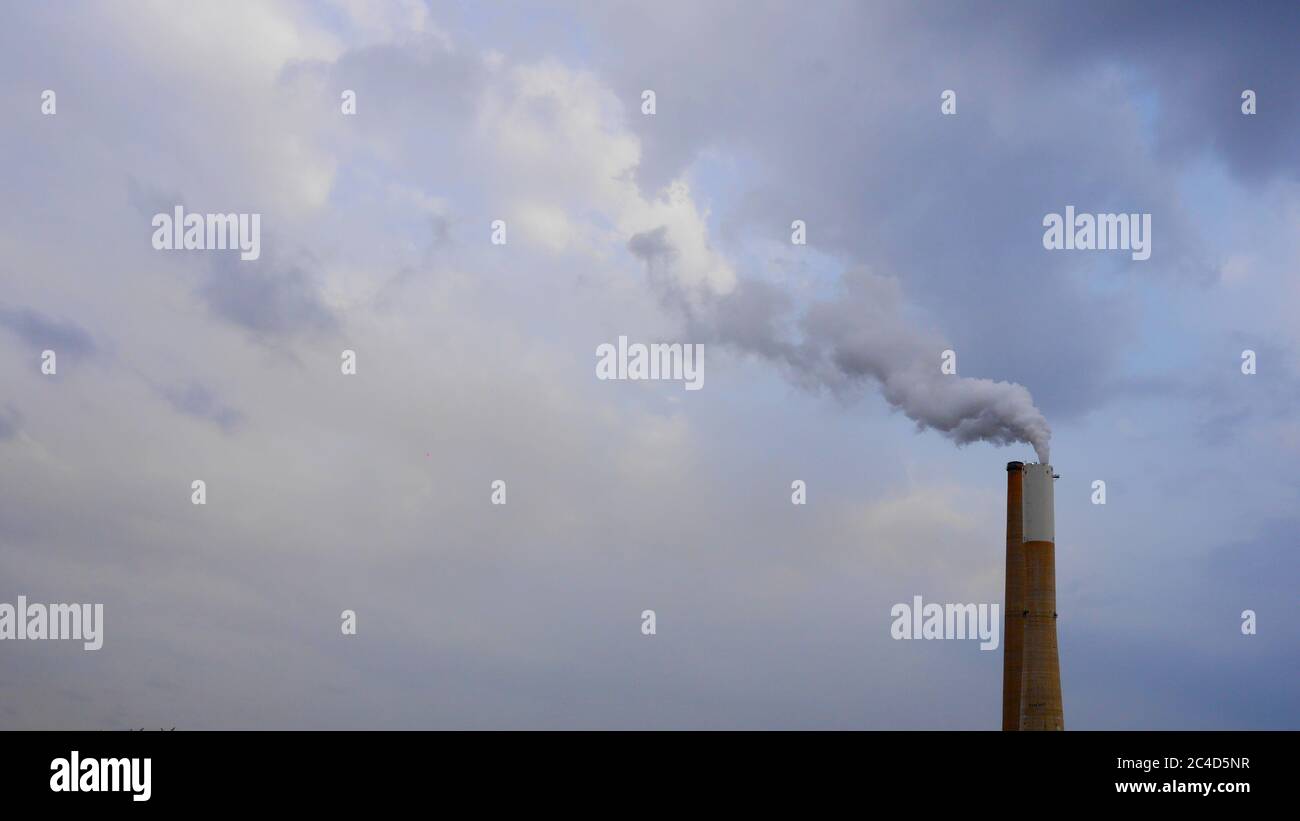 Industrial chimney with gases and smoke coming out - concept: air pollution Stock Photo