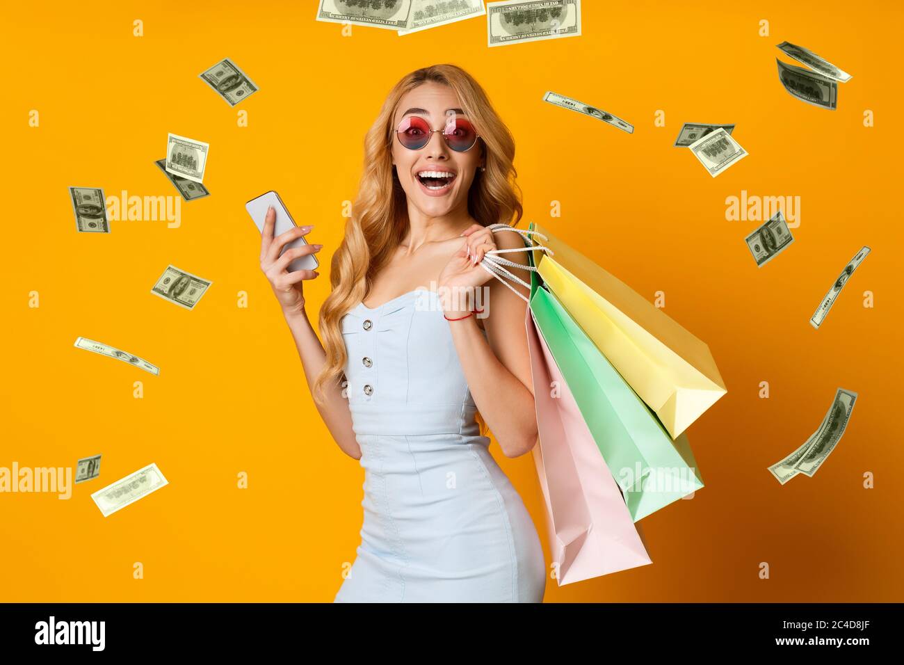 Cashback. Collage Of Woman With Smartphone And Shopping Bags Under Money Shower Stock Photo