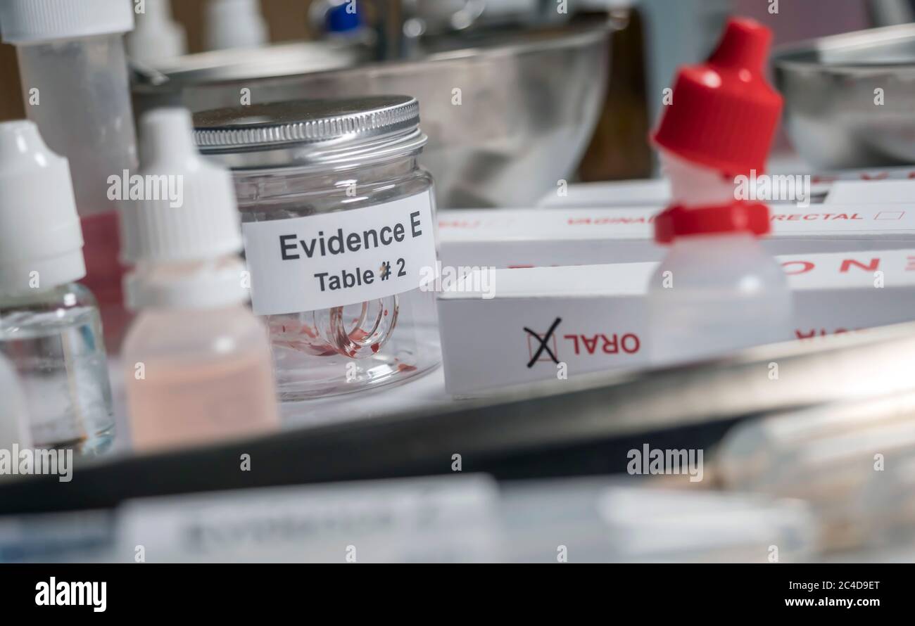 Blood-stained glass sample in an evidence jar, concept image Stock Photo
