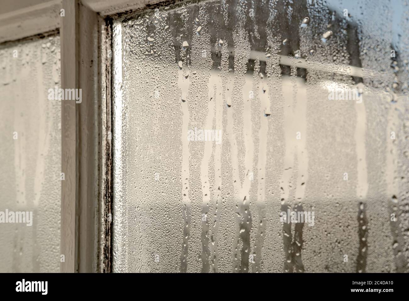 Interior of an old cottage, showing heavy water condensation on the