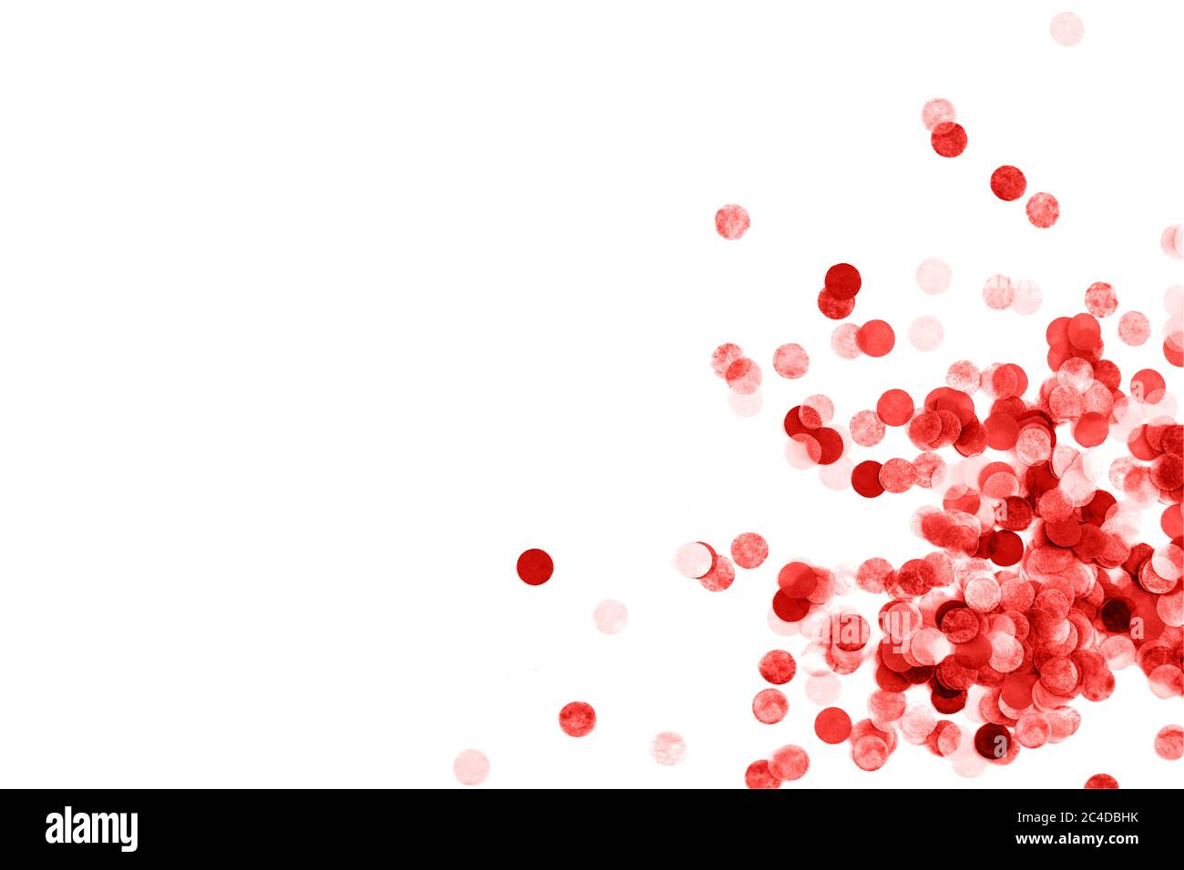 Bright red confetti isolated on white background Stock Photo - Alamy