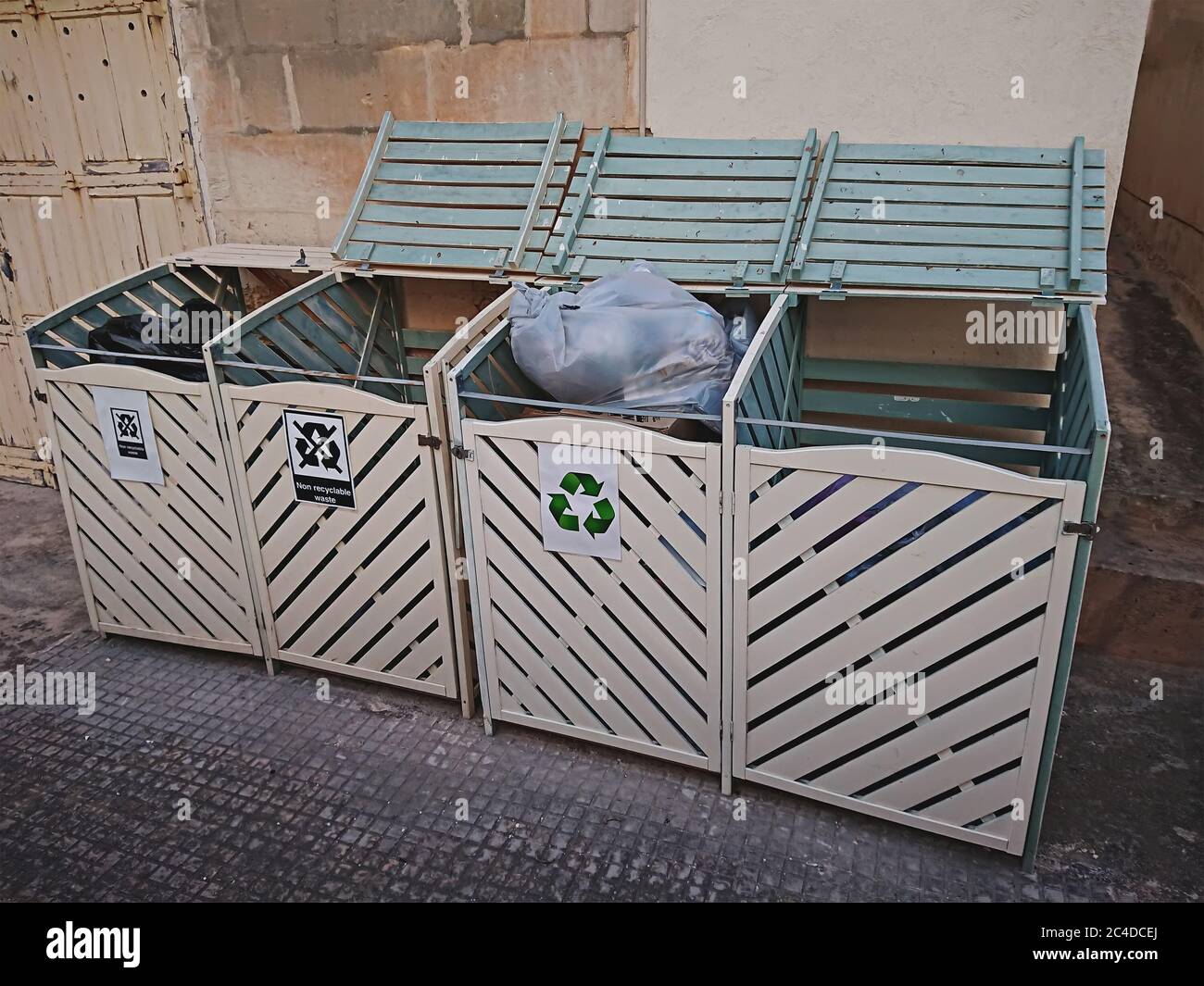 Wooden litter boxes. Sorting waste by type of paper, plastic and non