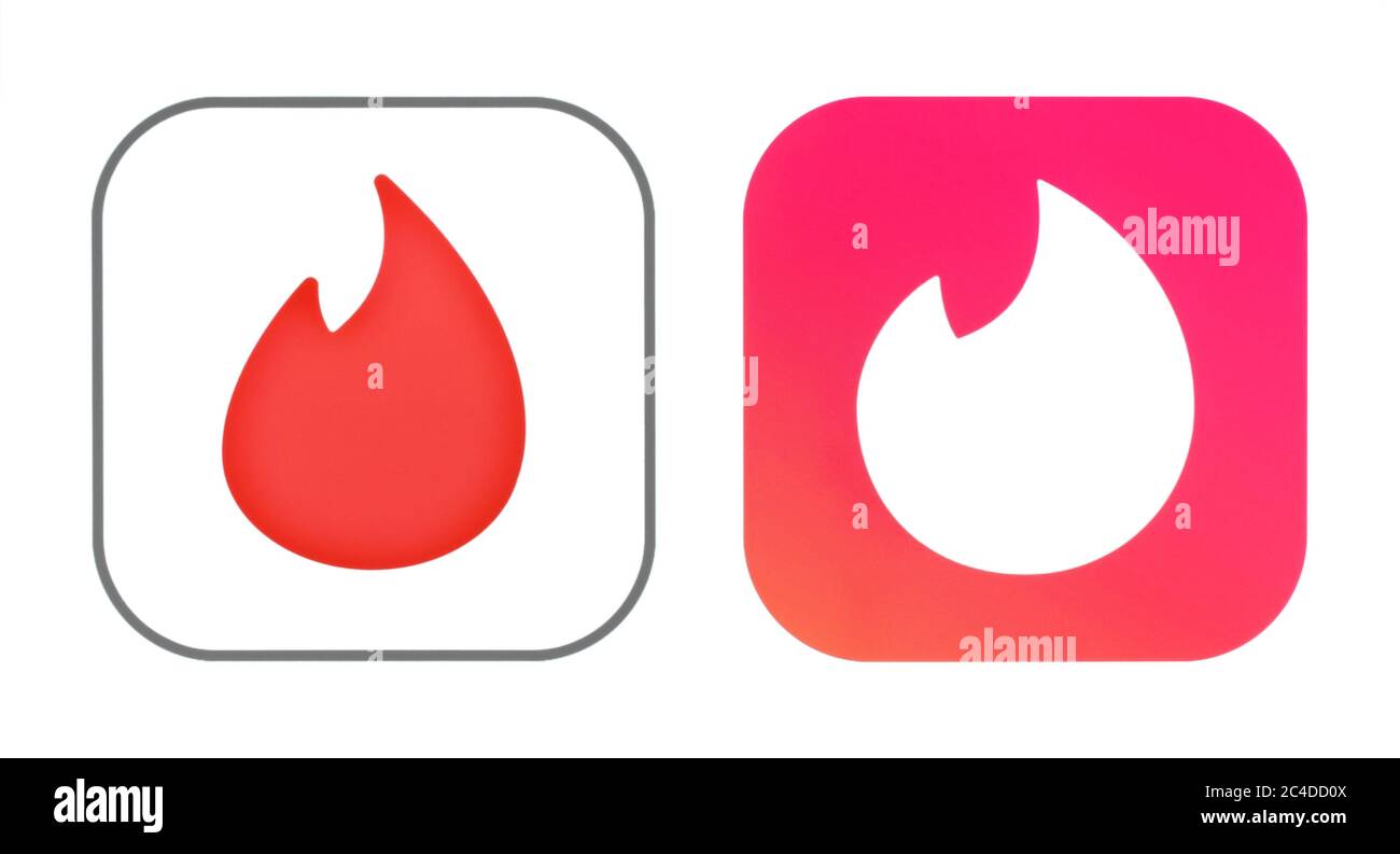 Kiev, Ukraine - November 02, 2019: New and old Tinder icons printed on white paper. Tinder is a location-based social search mobile app and Web applic Stock Photo