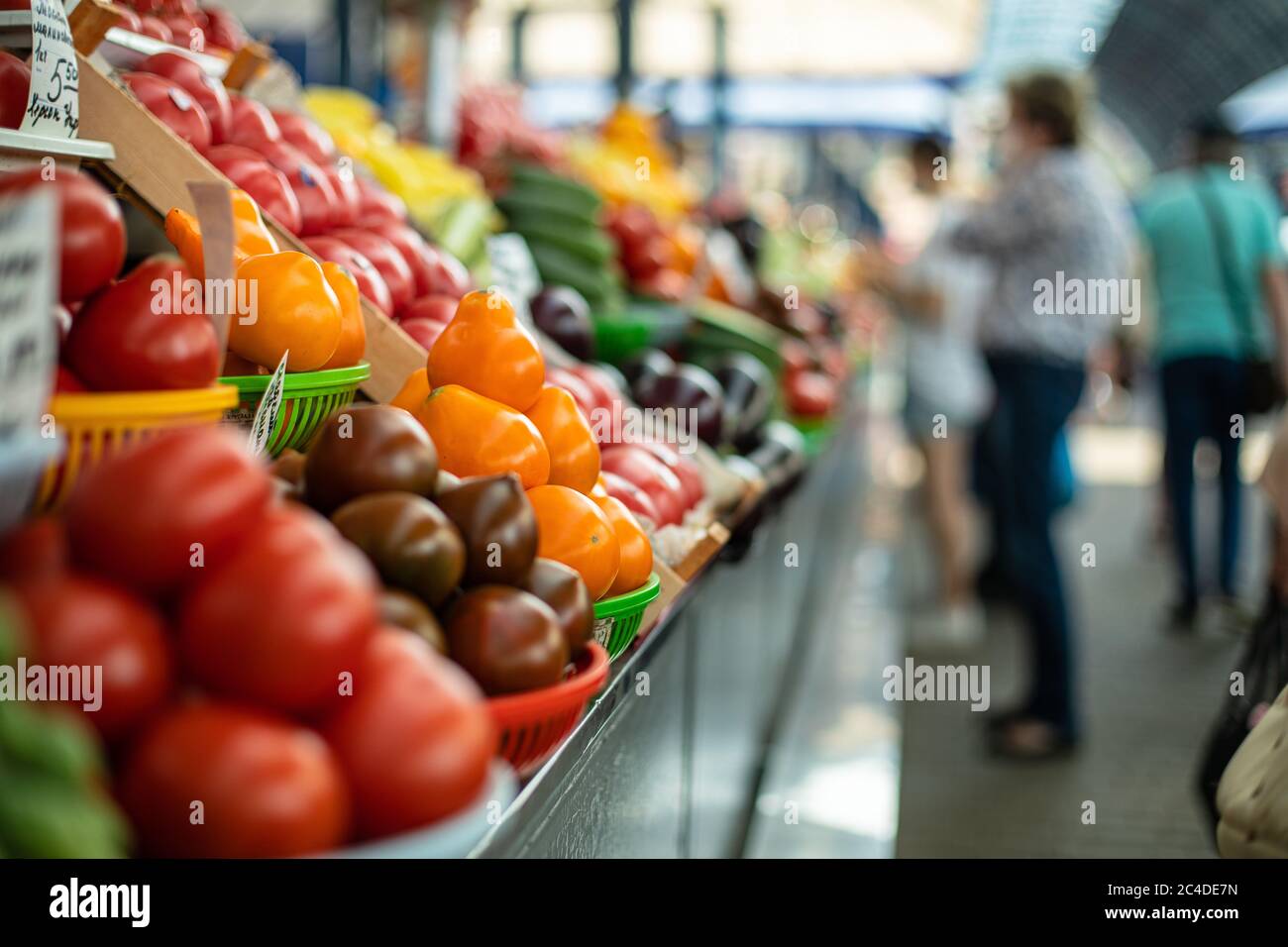 Fresh vegetables at a farmers market indoors Stock Photo - Alamy