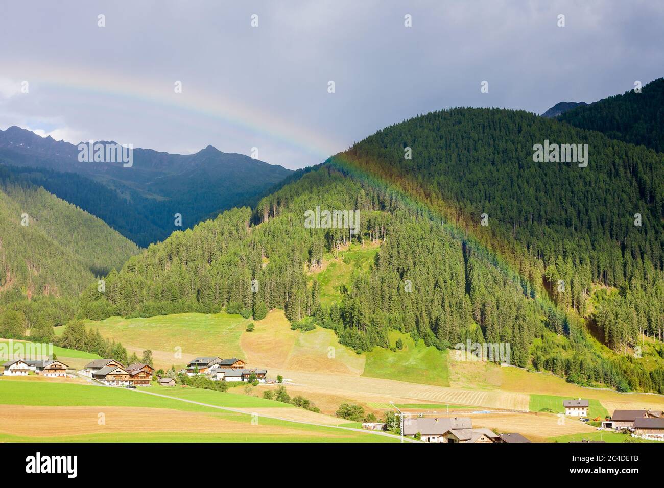 Beautiful rainbow at Santa Maddalena Valley, Sudtirol (Dolomites, Italy). Stock Photo
