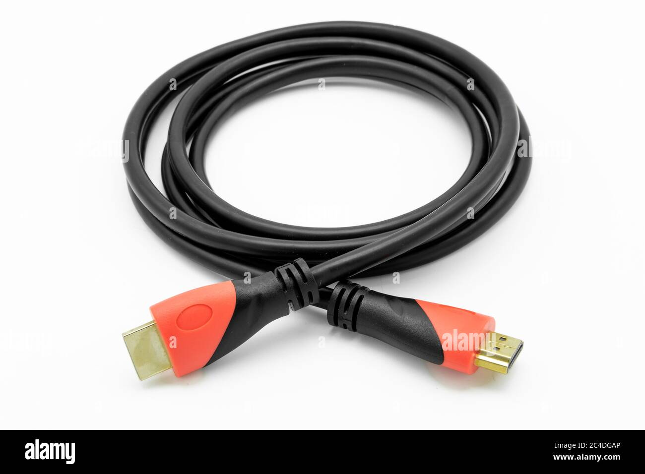 HDMI to HDMI A/V connection cable. Showing the gold HDMI connectors and thick connector plug boot assembly. Used for UHD TVs Stock Photo