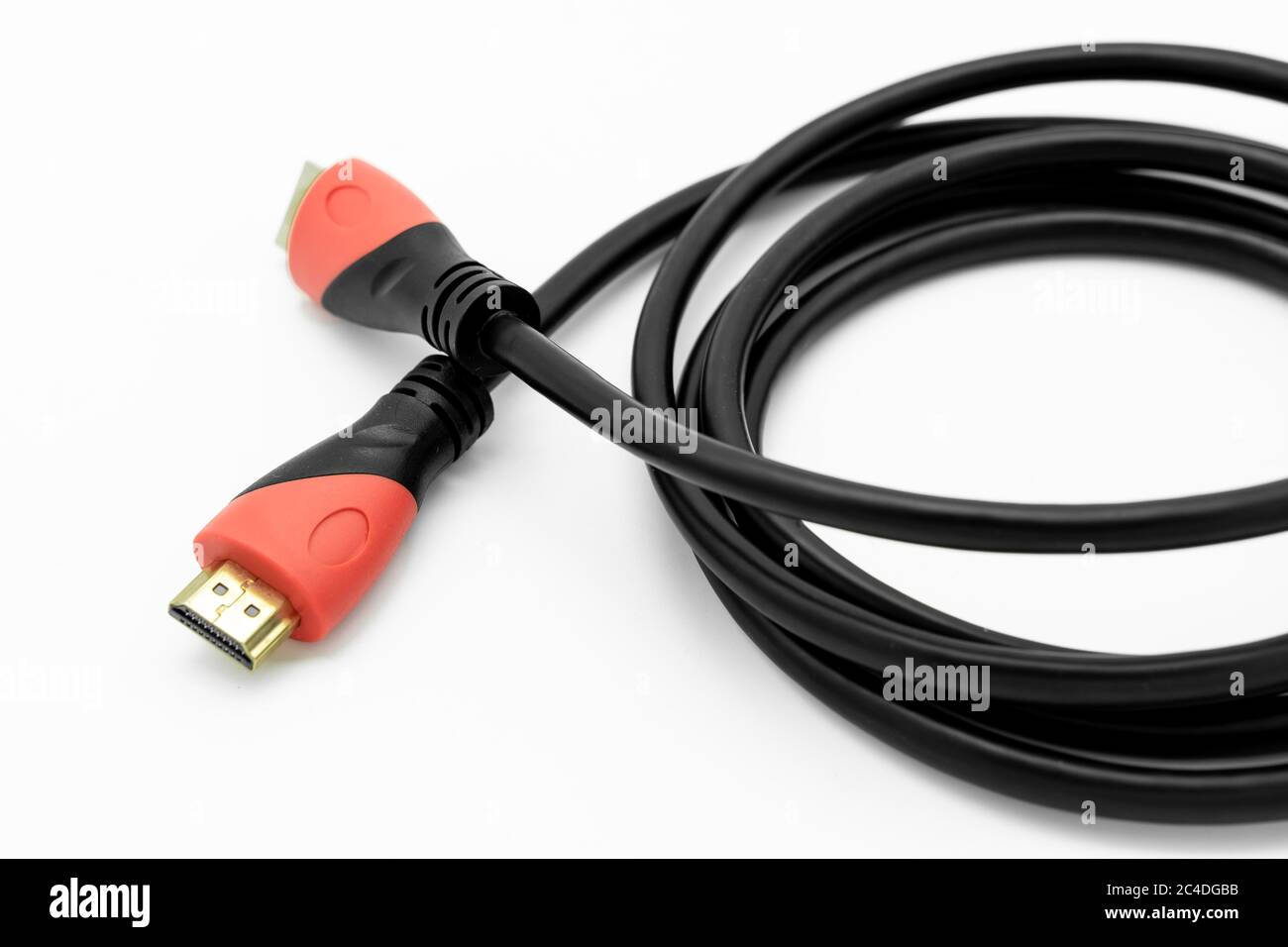 HDMI to HDMI A/V connection cable. Showing the gold HDMI connectors and  thick connector plug boot assembly. Used for UHD TVs Stock Photo - Alamy