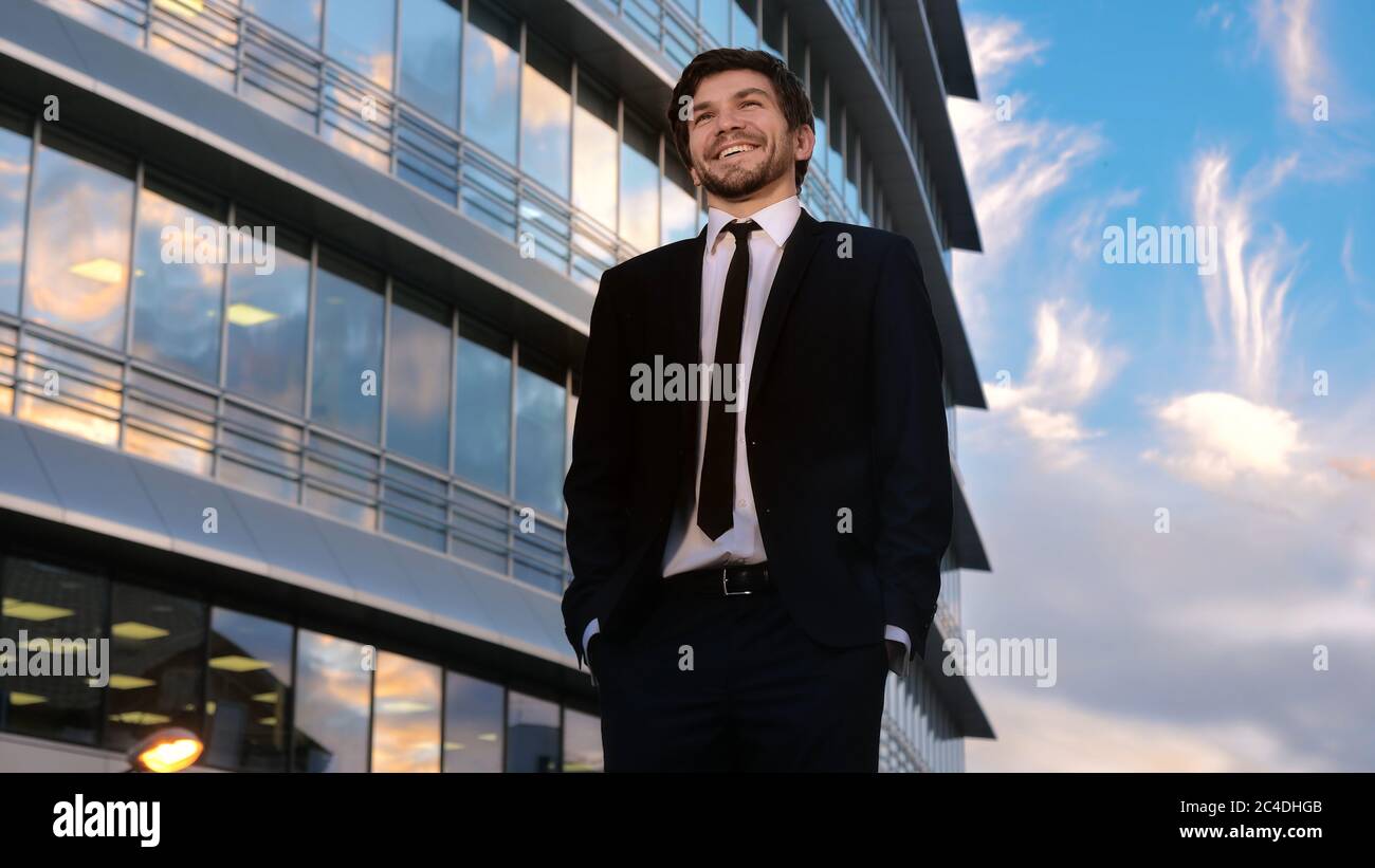 Business executive standing in front hi-res stock photography and ...