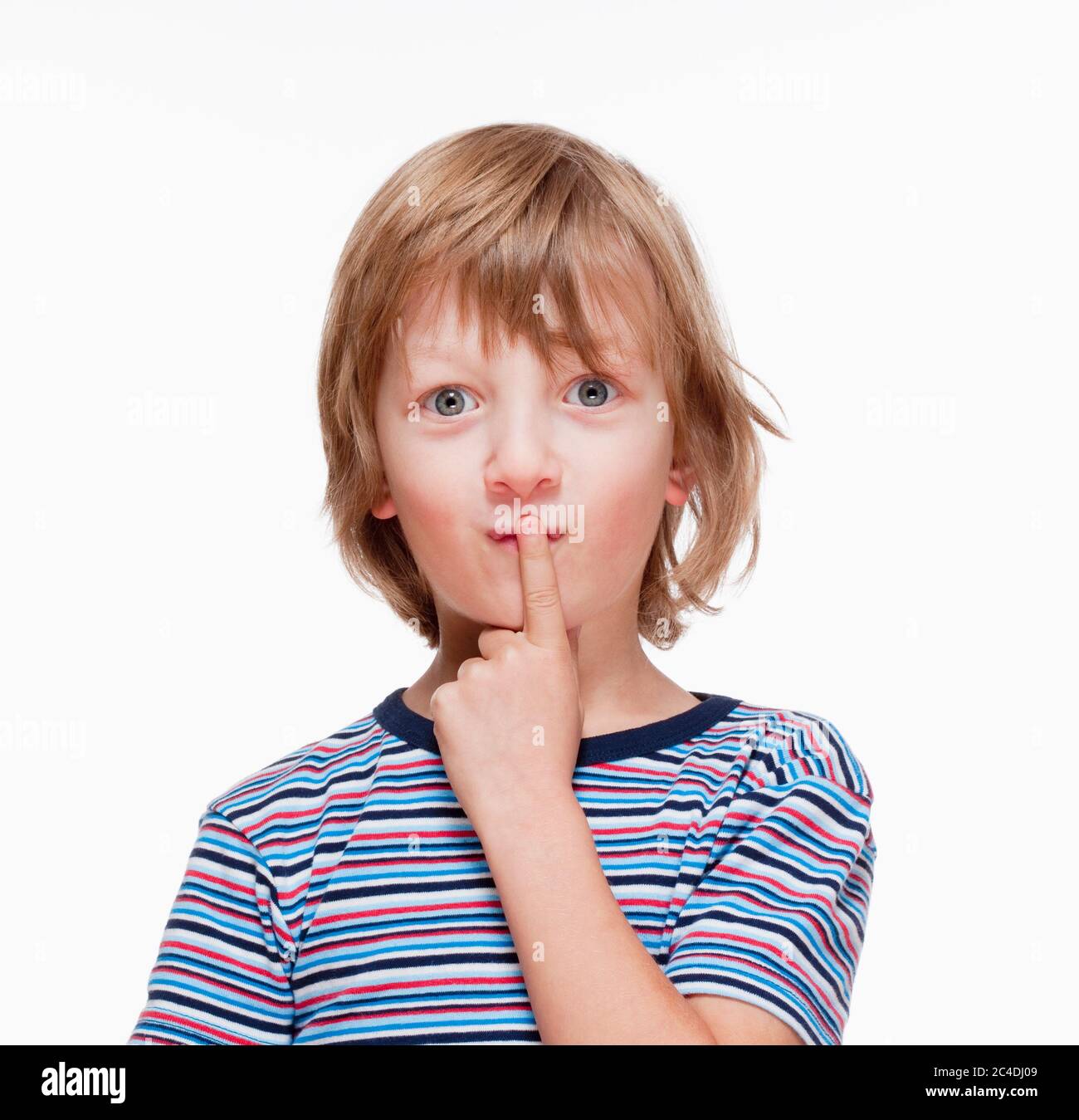 Boy Looking Thinking, Finger on his Mouth - Isolated on White Stock Photo
