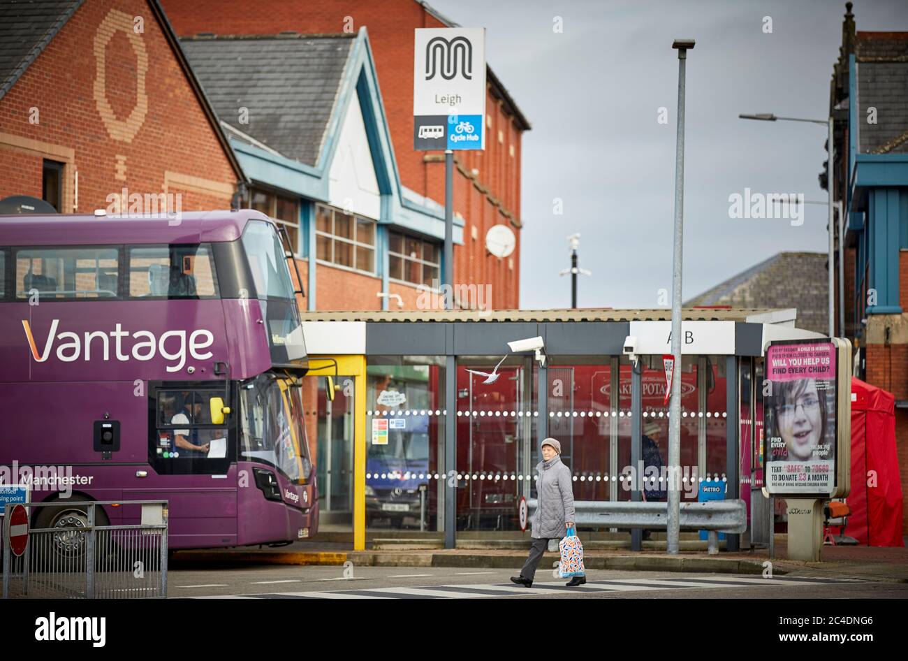 The bus station in Leigh town centre with a The First operated Vantage guided bus at the stand Stock Photo