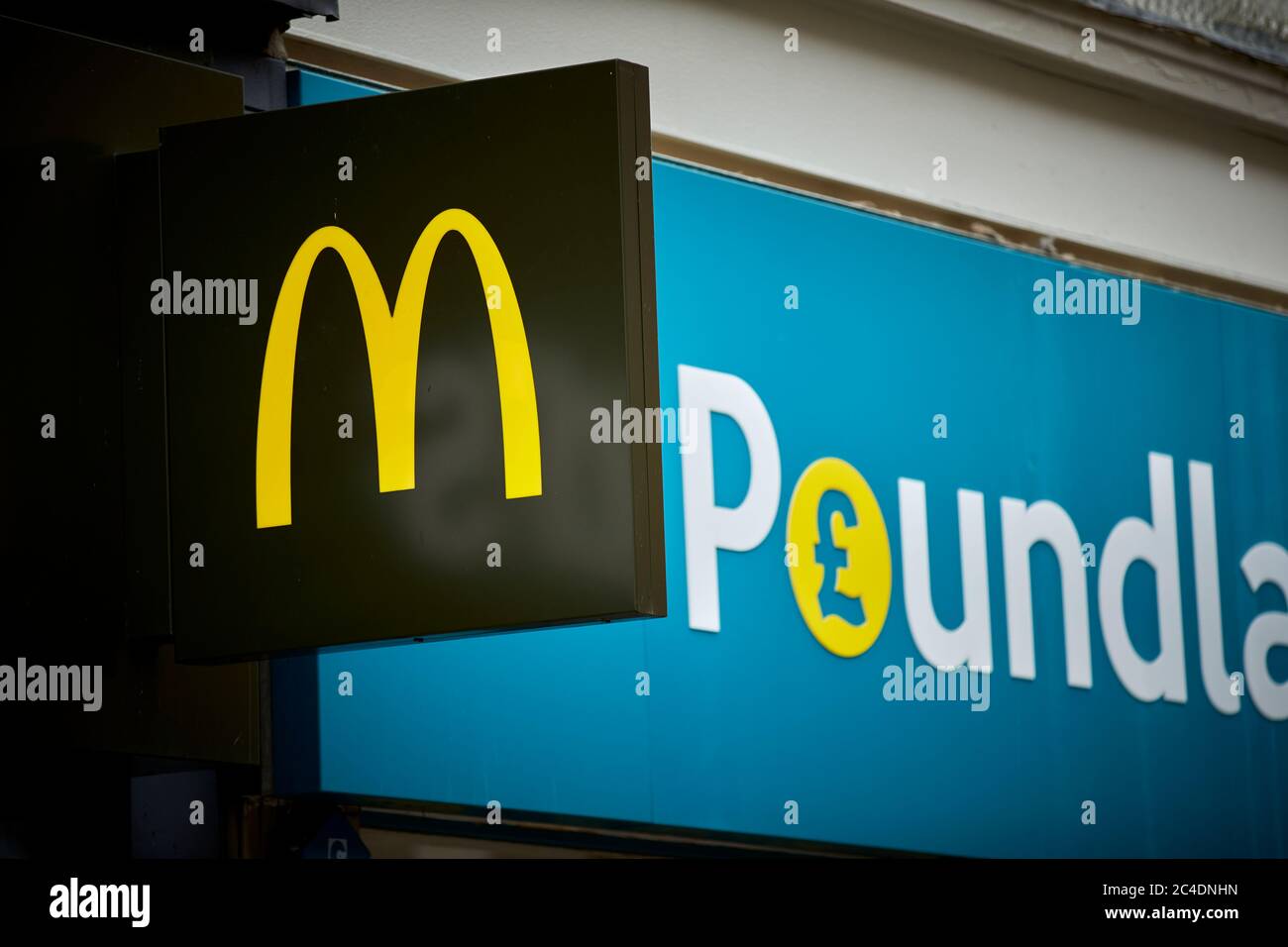 McDonalds and Poundland signs on Bradshawgate in Leigh town centre Greater Manchester Stock Photo