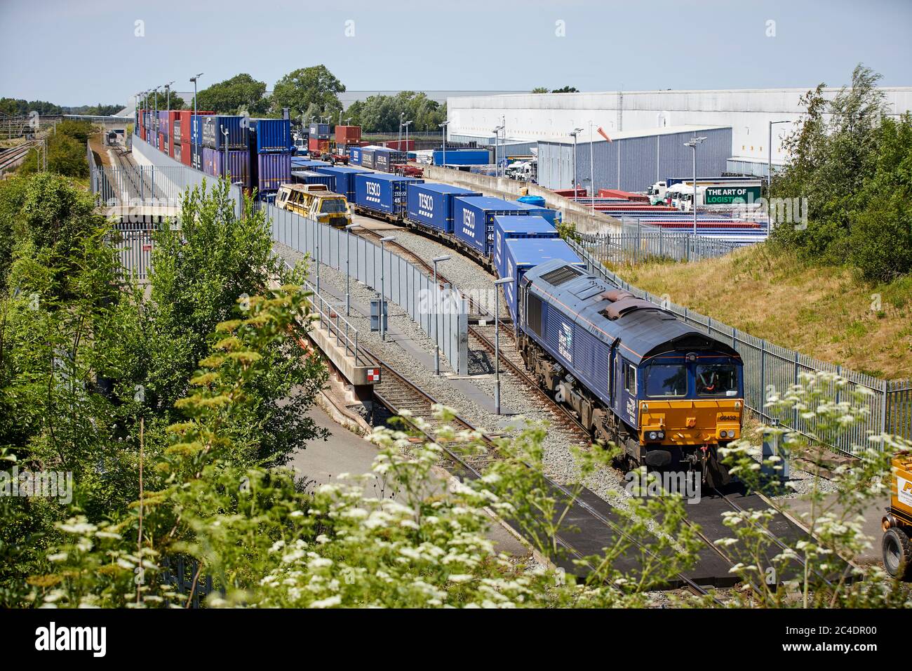 Tesco grocery distribution centre Daventry International Rail Freight Terminal DIRFT 2 rail road intermodal freight terminal warehousing estate Northa Stock Photo