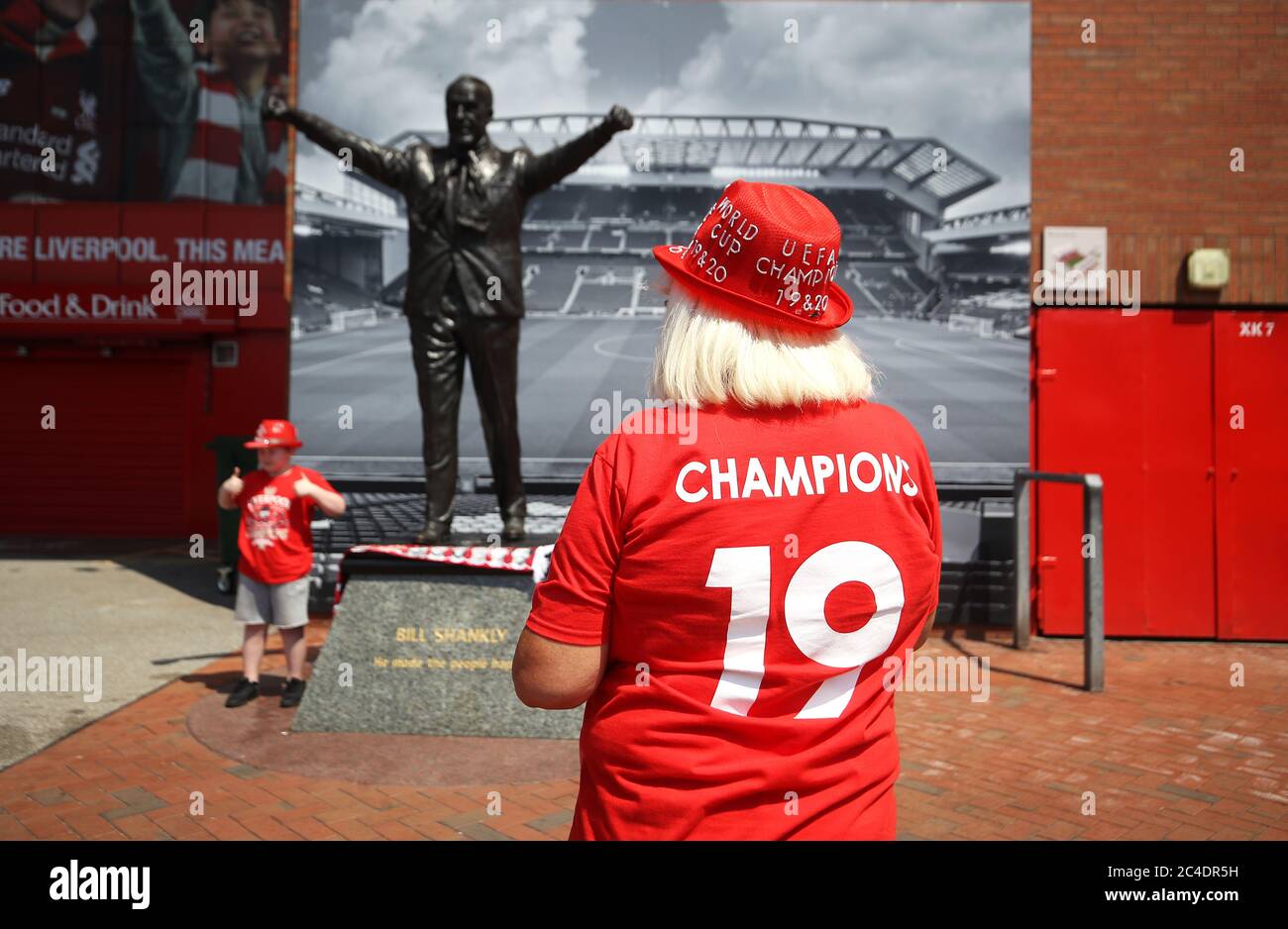 Liverpool fans Beryl Meland and grandson Archie pose for a photo with