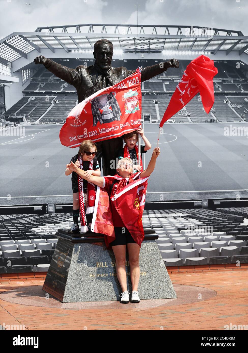 Liverpool fan Jean Smith with her grandsons Rocco and Gio (right) with