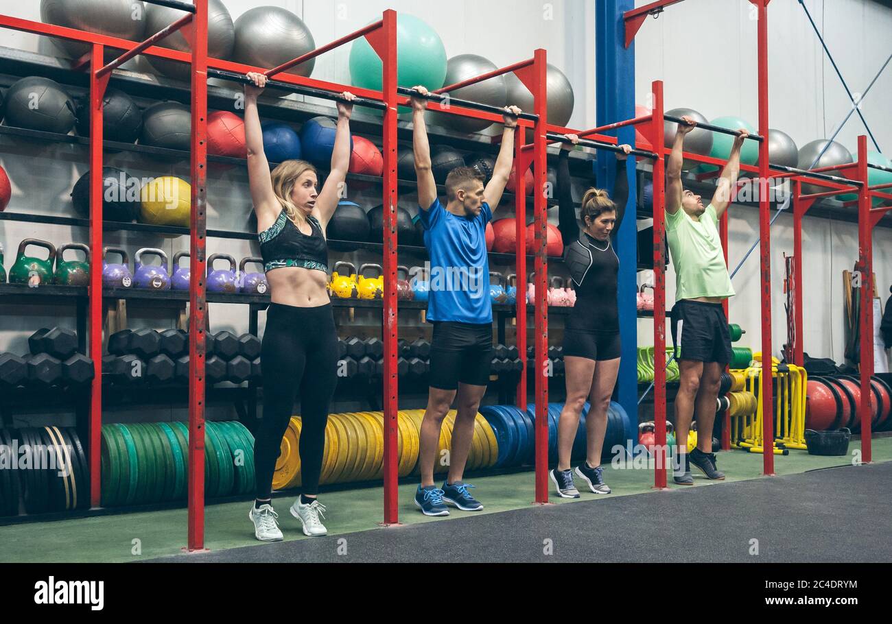 Athletes ready to do pull ups in the box Stock Photo