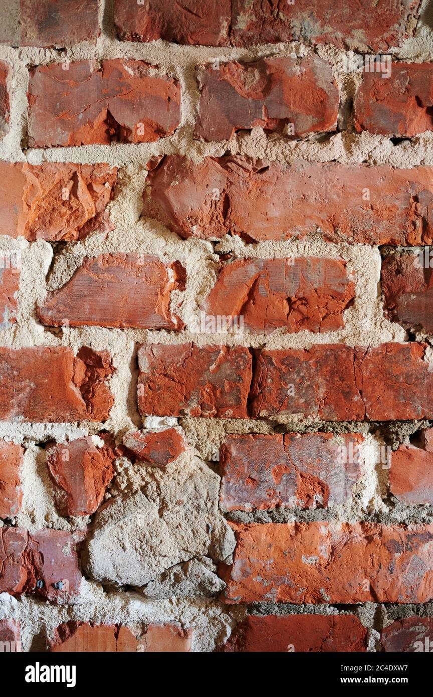 Red brick wall background vertical close up view Stock Photo