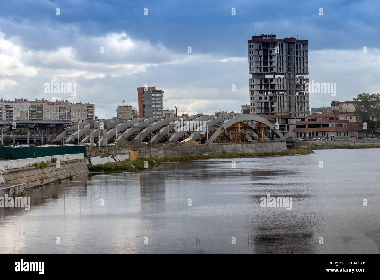 A high-rise building under construction on the banks of the Miass River in Chelyabinsk, Russia. Stock Photo