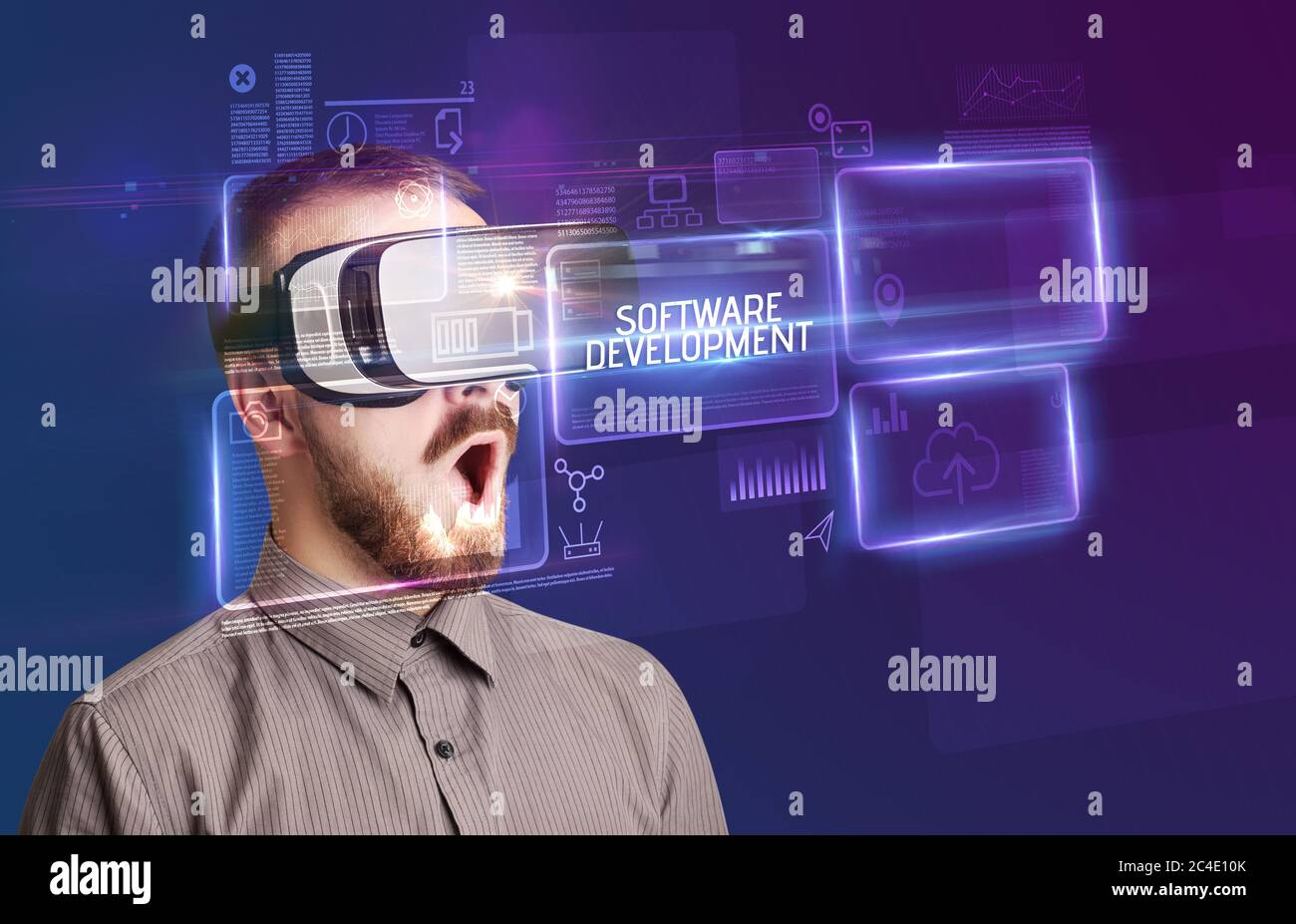 Businessman looking through Virtual Reality glasses with SOFTWARE ...