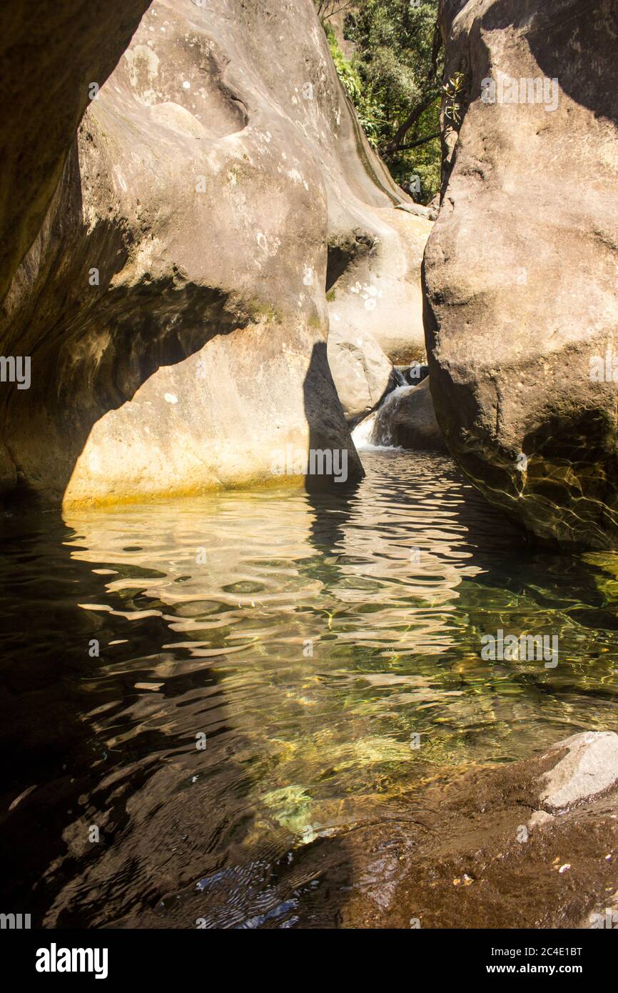 A sheltered pool filled with clear mountain water, in the upper flow of the Tugela River in the Drakensberg Mountains, South Africa Stock Photo