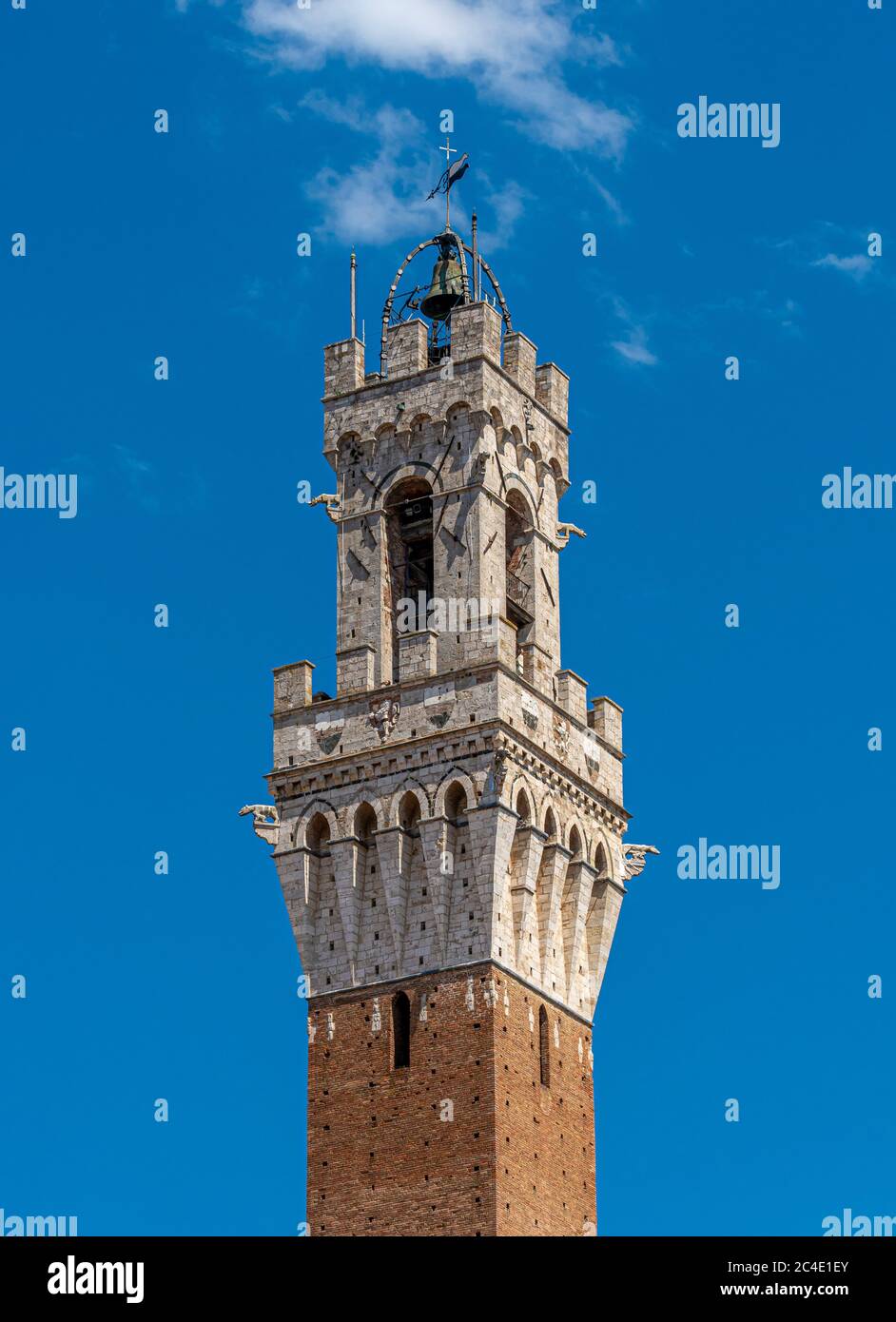 The top section of Torre del Mangia in Piazza del Campo, Siena. Italy Stock Photo