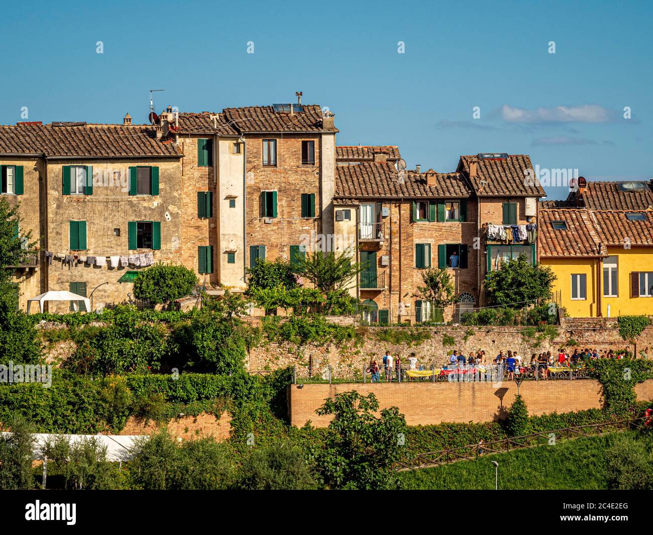 Group of  people dining outside on a terrace in Siena. Italy Stock Photo
