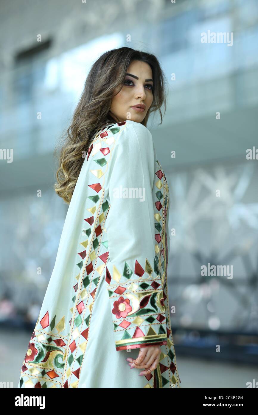 sachin and babi light blue dress Young Modern Muslim Woman Wearing Trendy Casual Clothes and Hijab. Arab  Female Character in Long Dress, Sneakers and Stock Vector main image 0
