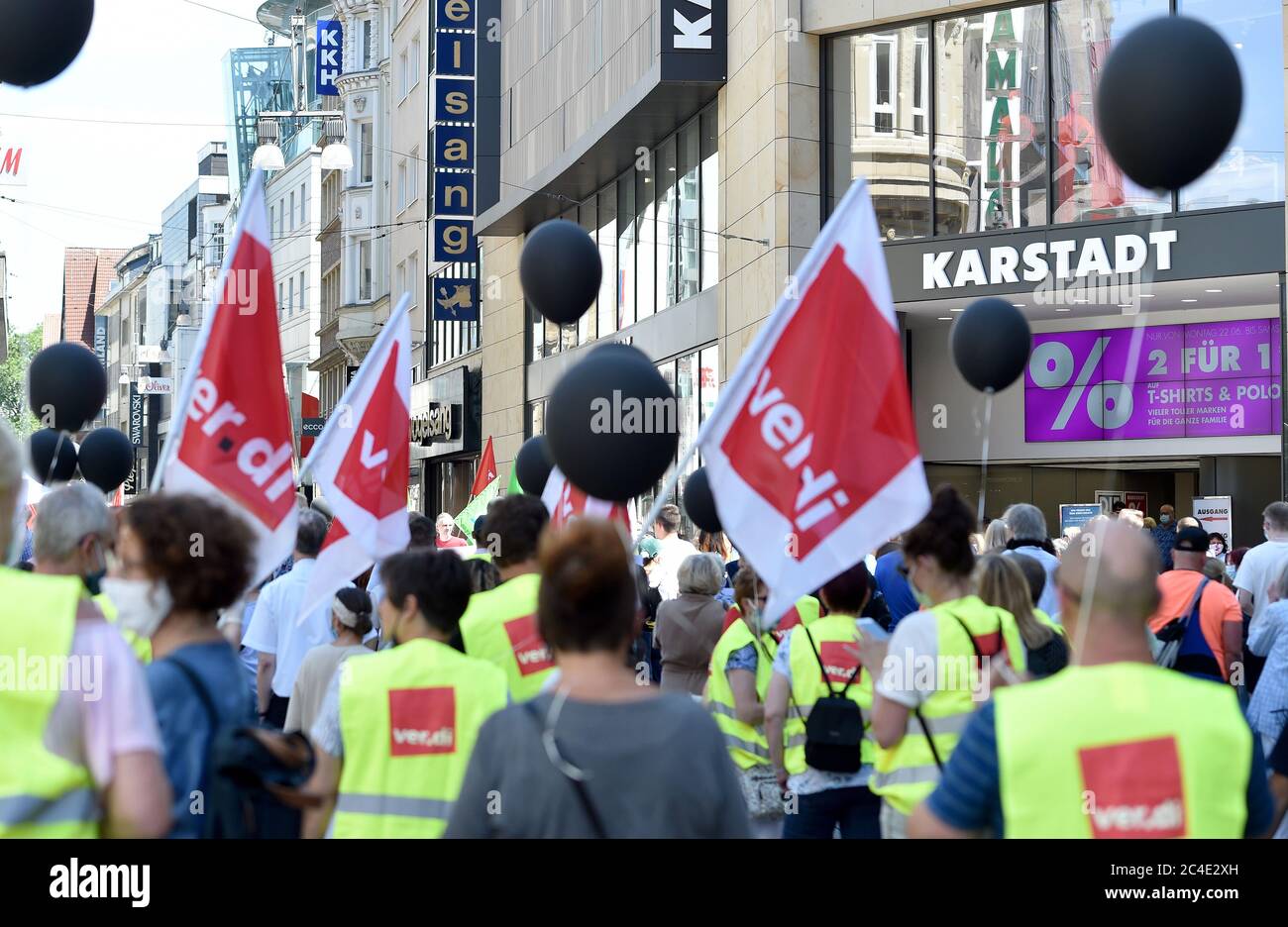 26 June 2020, North Rhine-Westphalia, Dortmund: Works council members of Galeria Karstadt Kaufhof and Karstadt Sports demonstrate in front of one of the two stores in the city centre. The ailing department store group had announced the closure of 62 of its 172 department stores last week. The company headquarters in Essen and the city of Dortmund are particularly hard hit. In both cities, the remaining two department stores are to be closed. Photo: Caroline Seidel/dpa Stock Photo